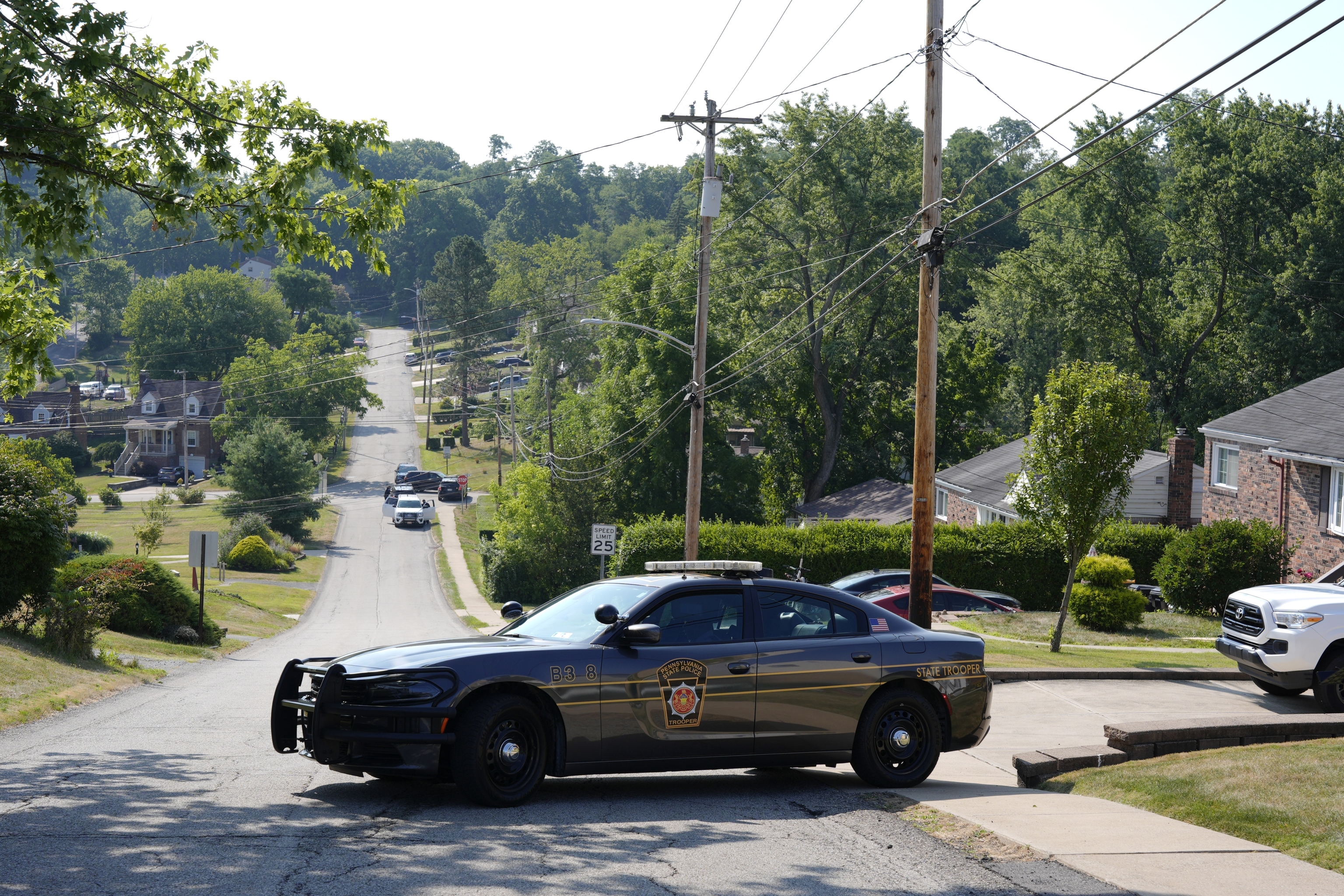 Law enforcement block a street in Bethel Park, Pa., that they say was a residence of Thomas Matthew Crooks.