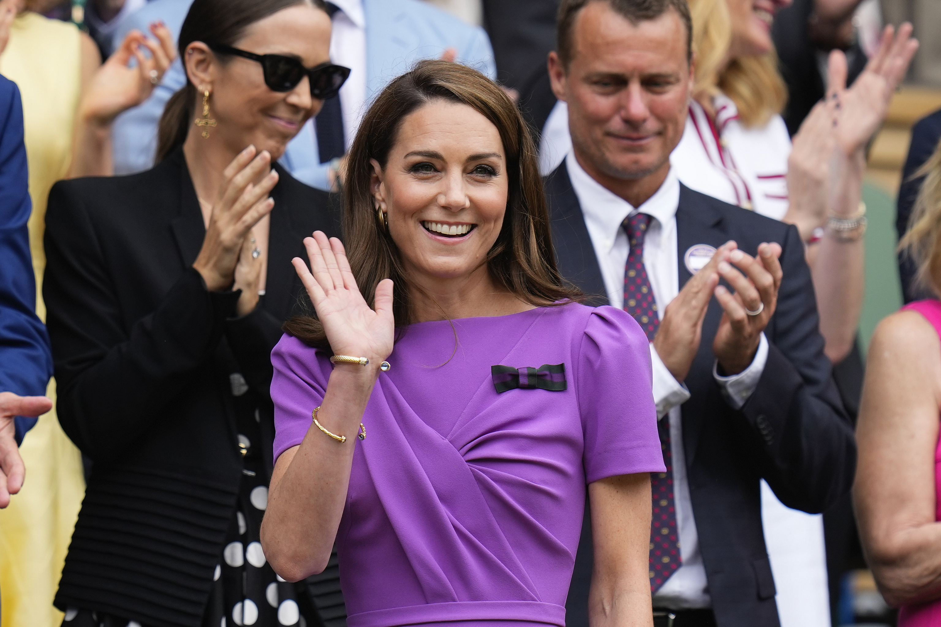 Kate, Princess of Wales waves as she arrives on Centre Court ahead of the men's singles final at the Wimbledon tennis championships in London.