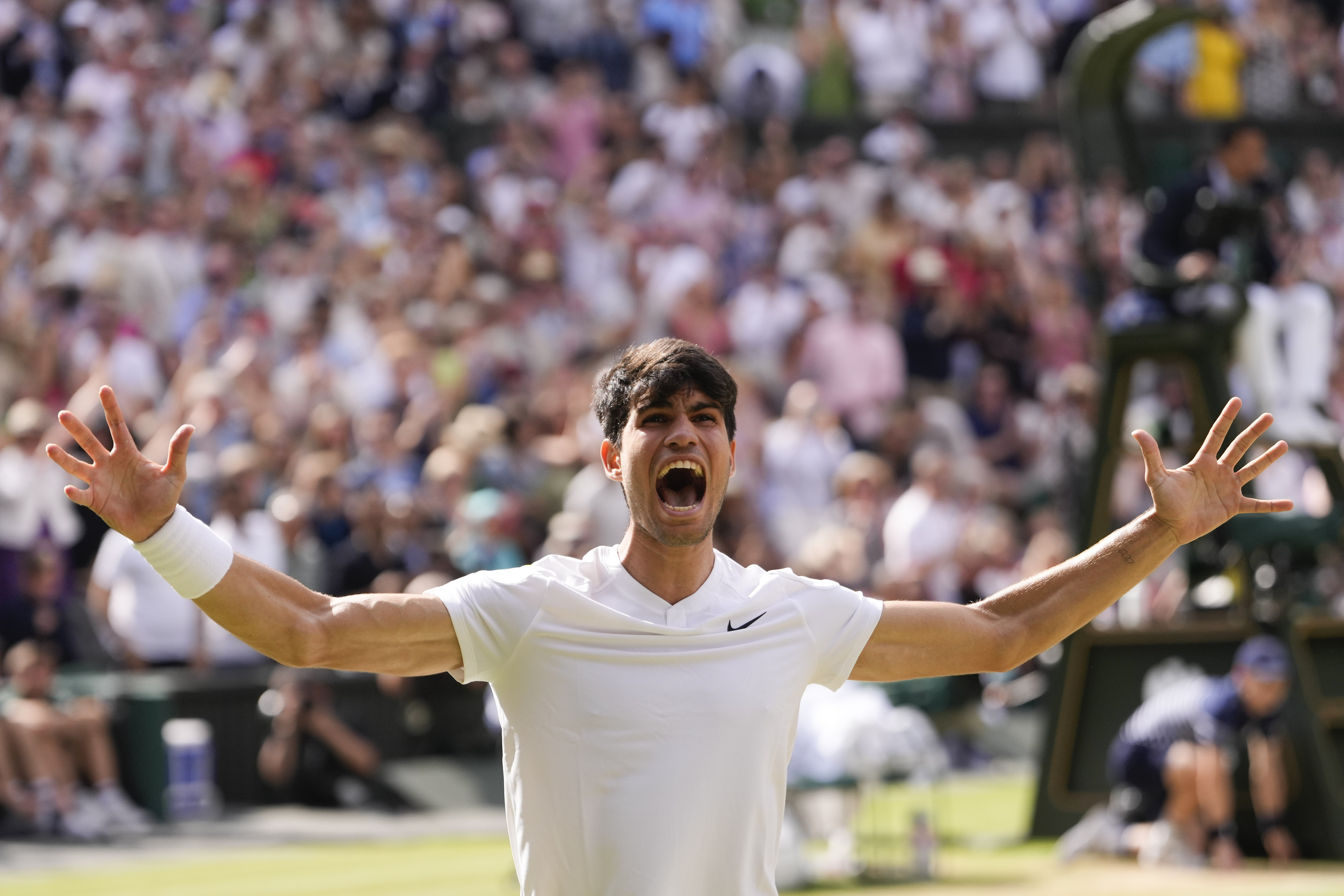 Carlos Alcaraz of Spain celebrates after defeating Novak Djokovic.