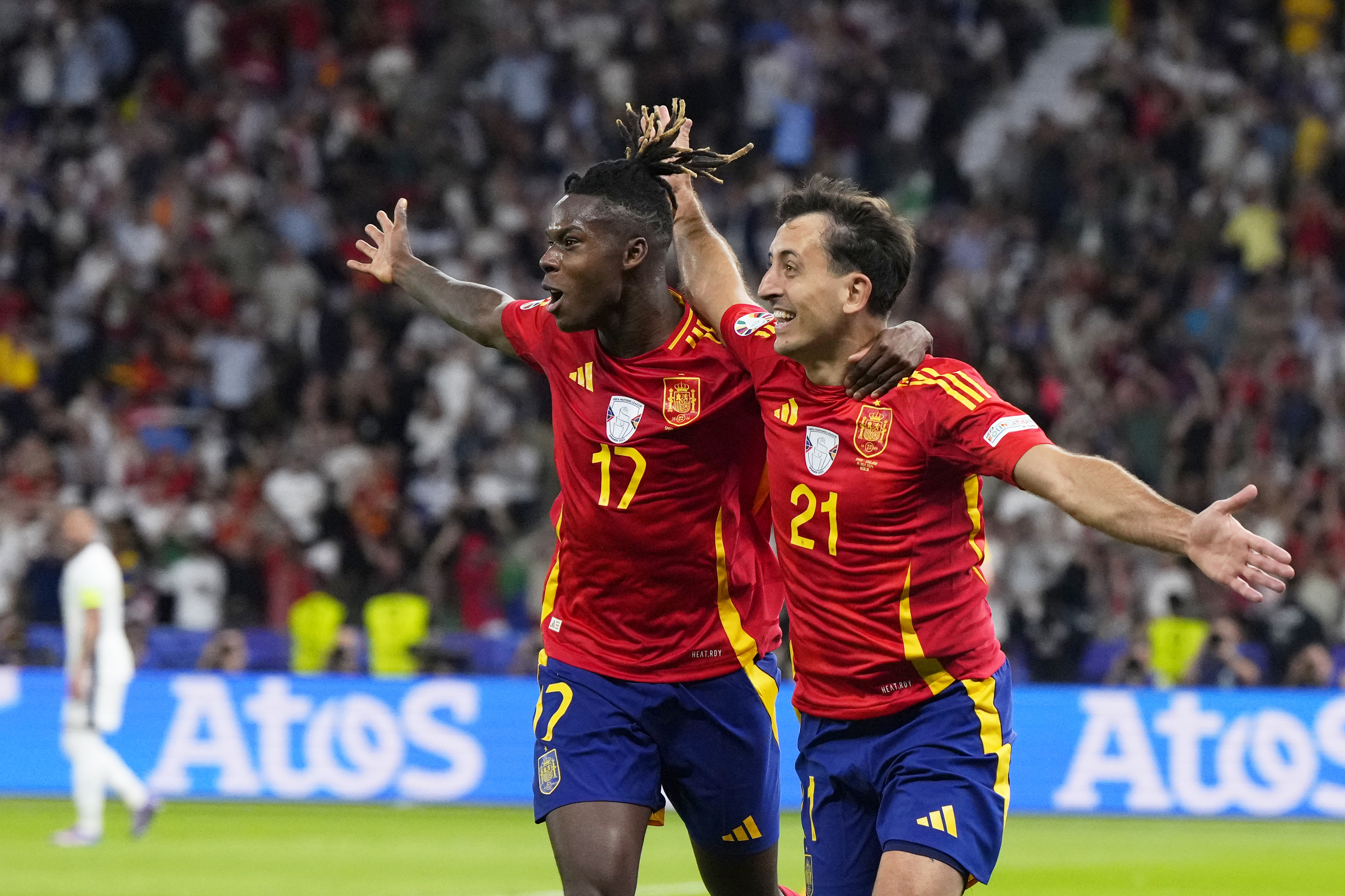 Spain's Mikel Oyarzabal celebrates with Nico Williams, left, after scoring his side's second goal during the final match between Spain and England at the Euro 2024.