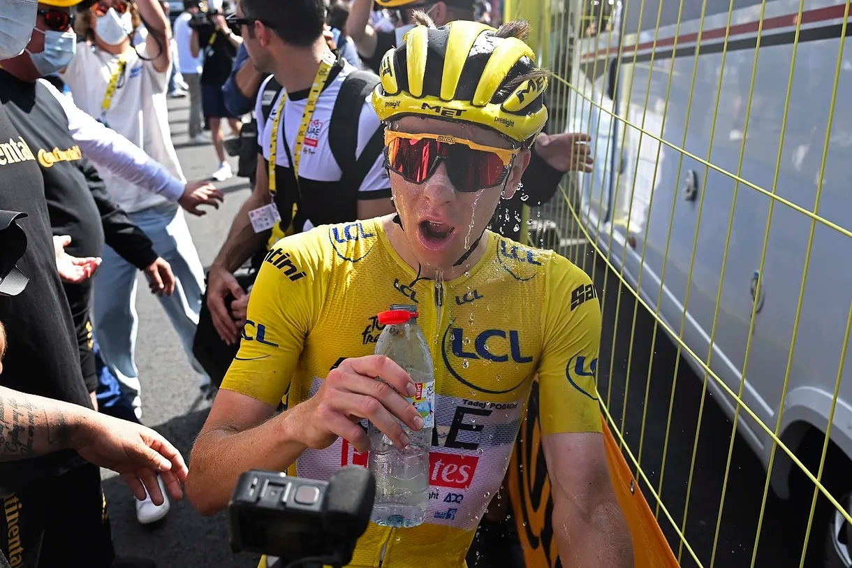 Pogacar refreshes after winning the stage at Plateau de Beille.