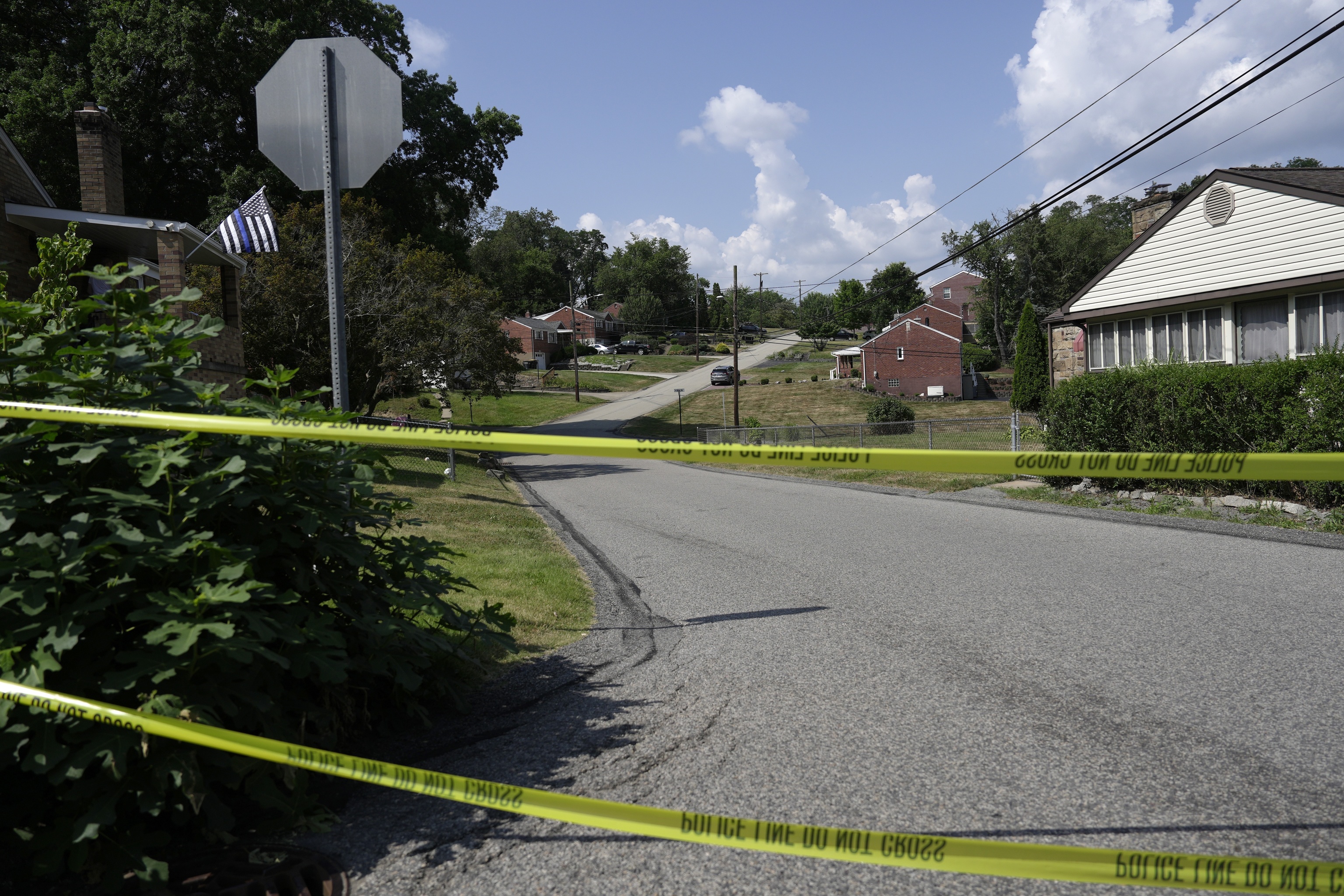 Police tape blocks a street in Bethel Park, near a residence of Thomas Matthew Crooks.