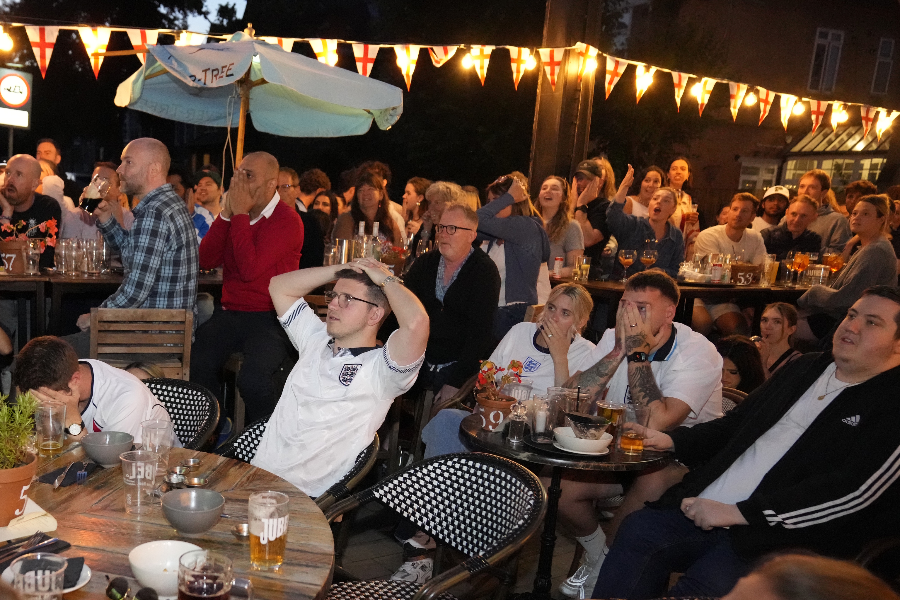 England fans react as they watch Spain win the Euro 2024.