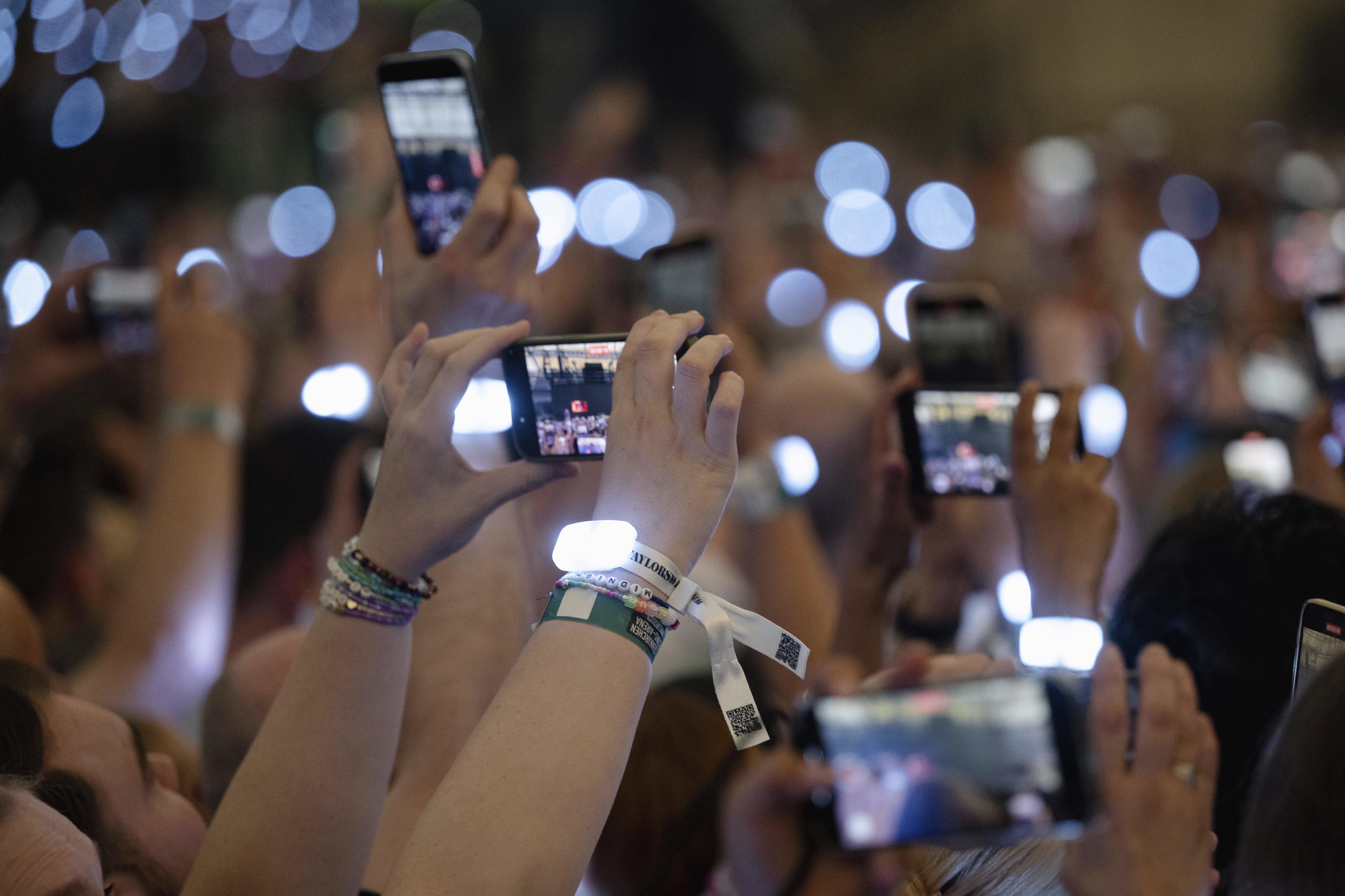 Spectators film during Taylor Swift's concert in Germany.