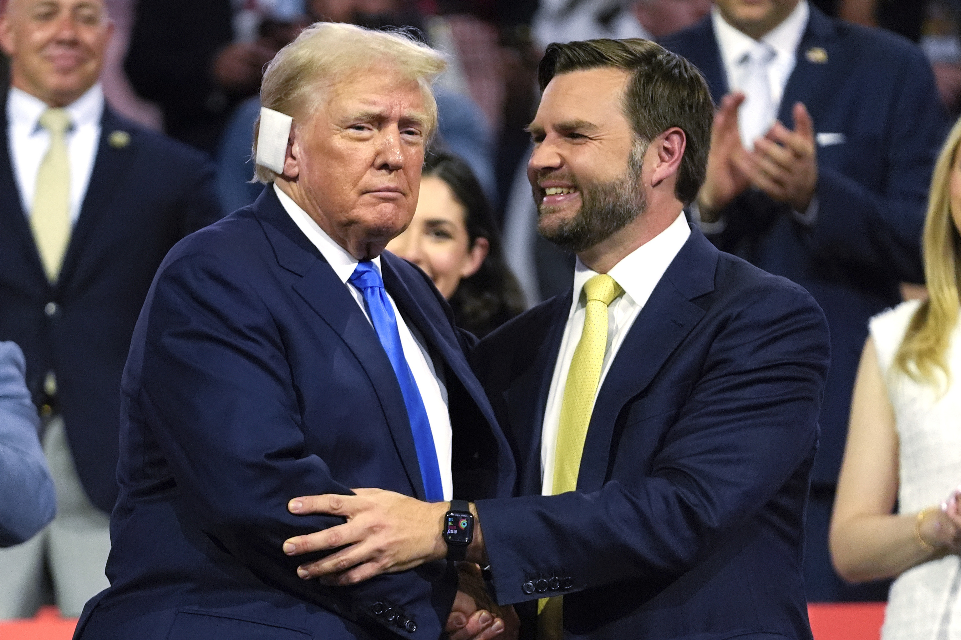 Republican presidential candidate former President Donald Trump, left, is introduced alongside Republican vice presidential candidate Sen. JD Vance.