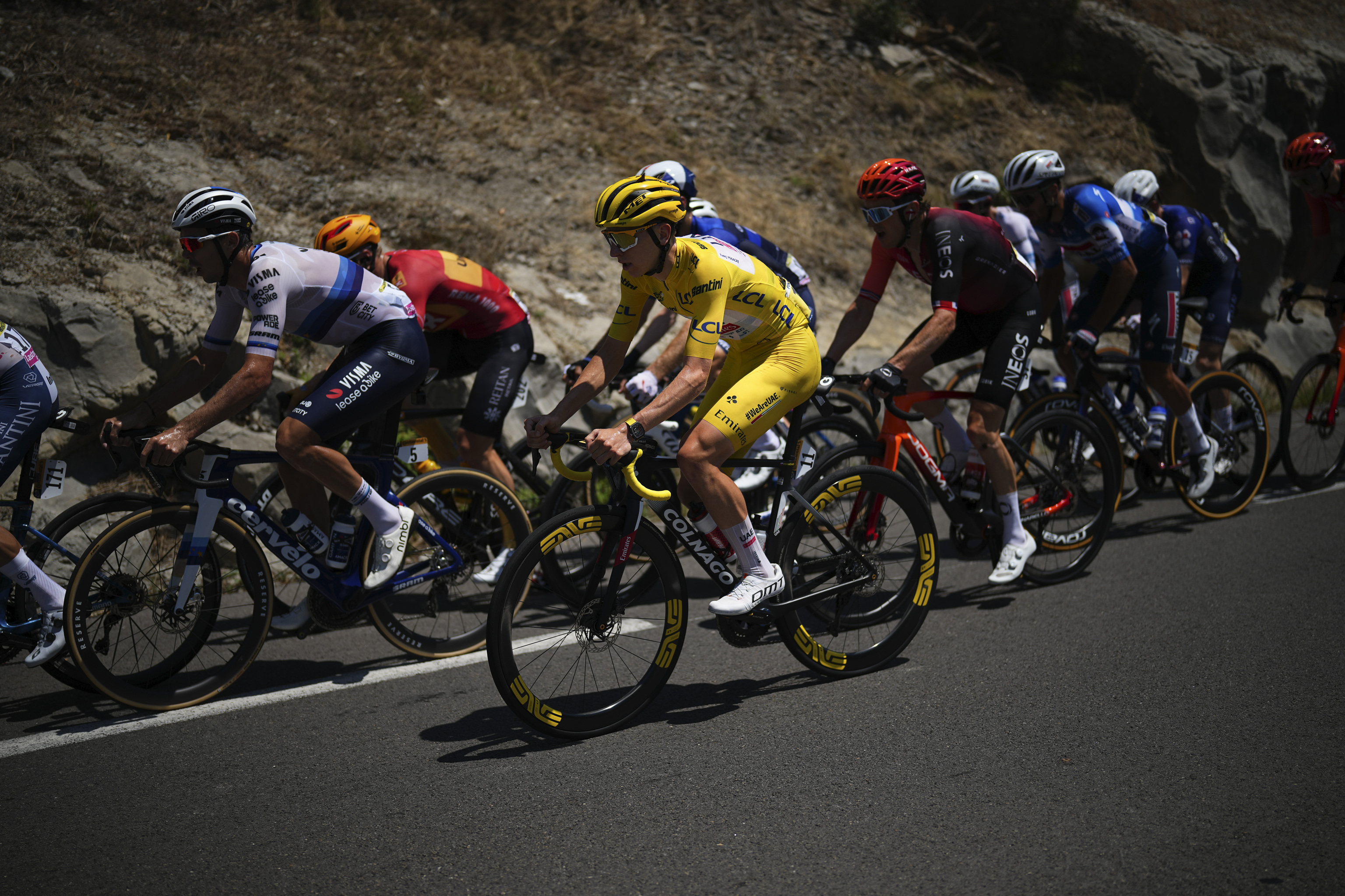 Slovenia's Tadej Pogacar, wearing the overall leader's yellow jersey.