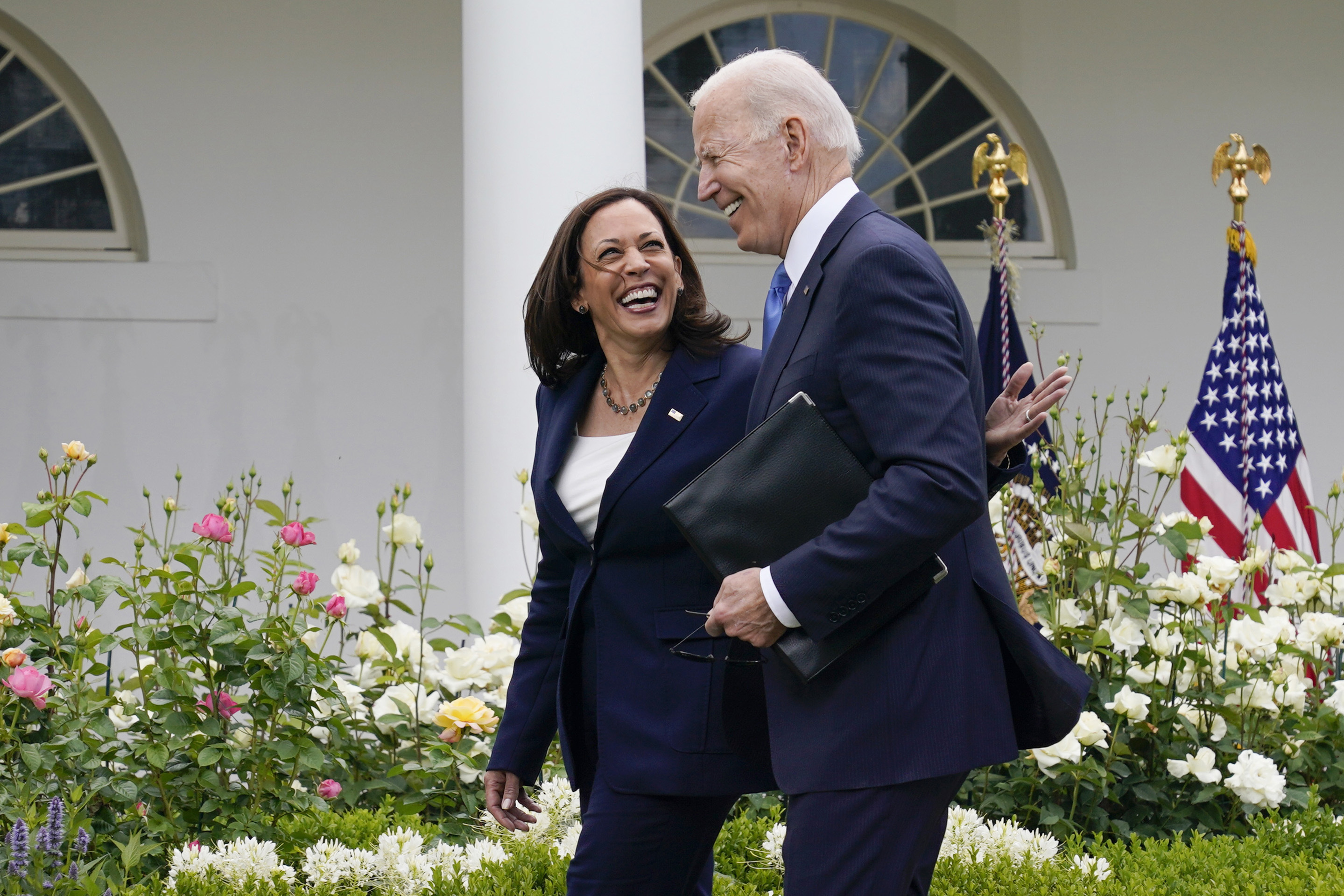 President Joe Biden, right, walks with Vice President Kamala Harris.