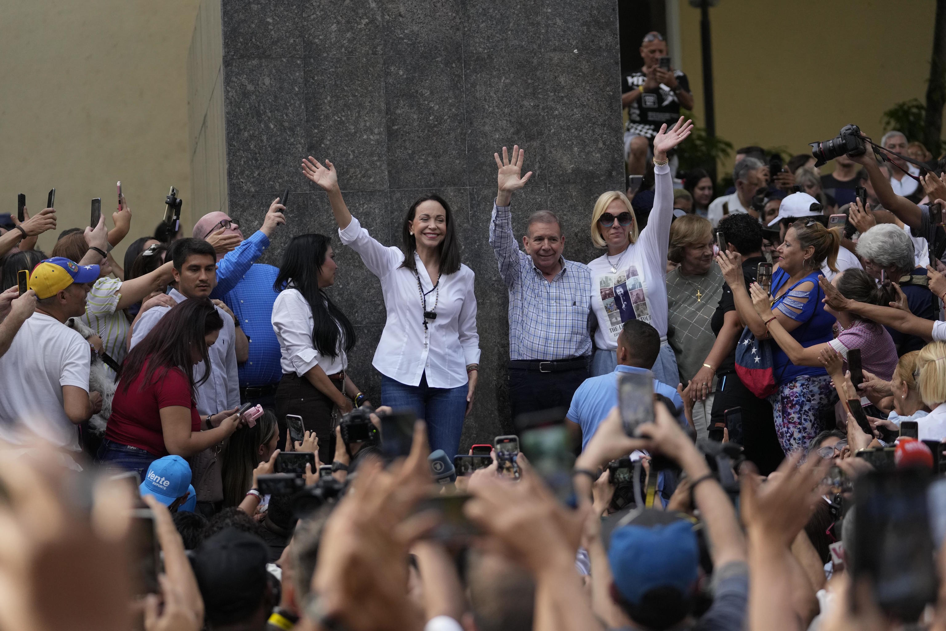 Maria C. Machado and Edmundo Gonzalez greet supporters.