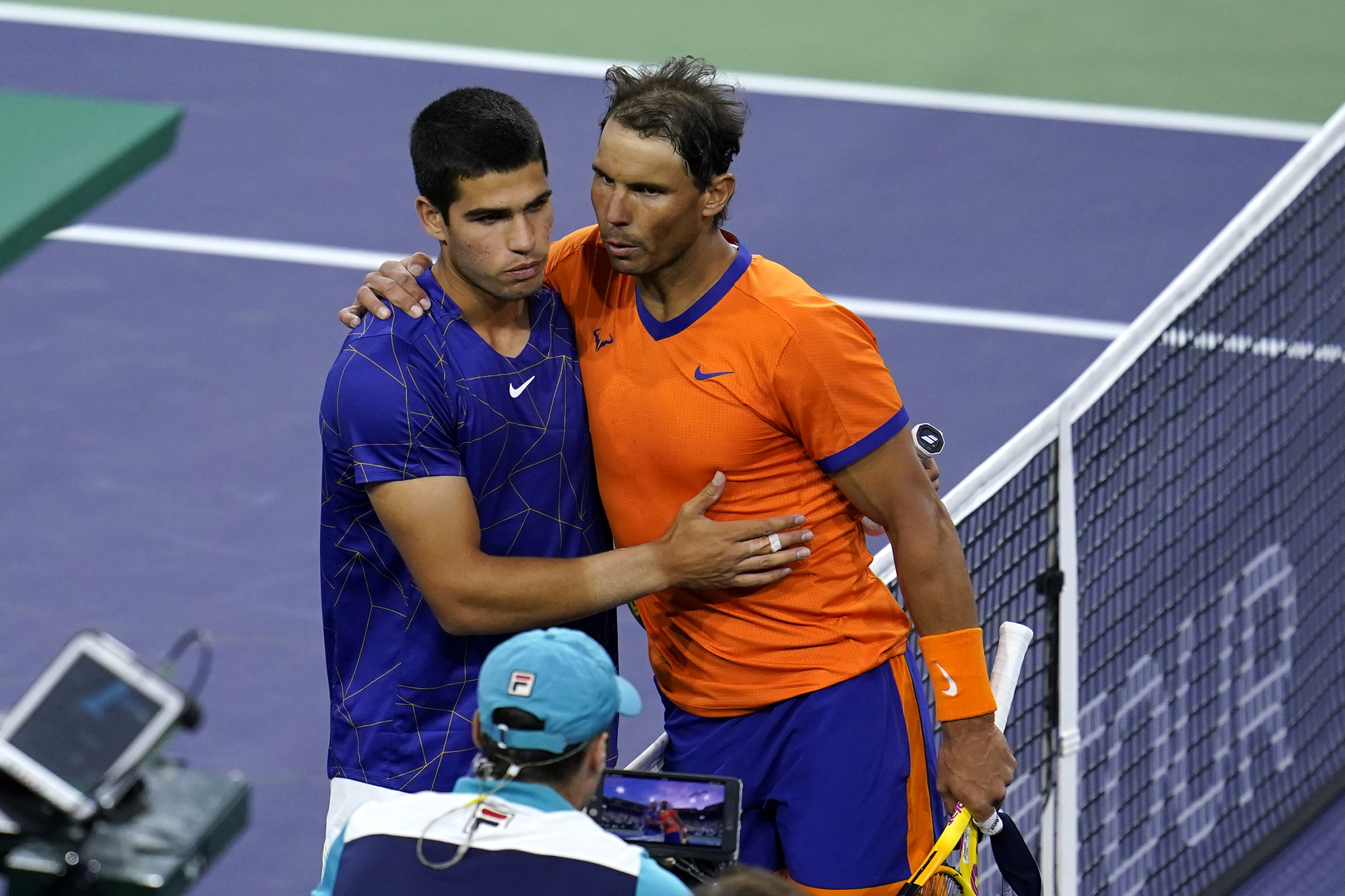 Rafael Nadal, of Spain, right, greets Carlos Alcaraz, of Spain.