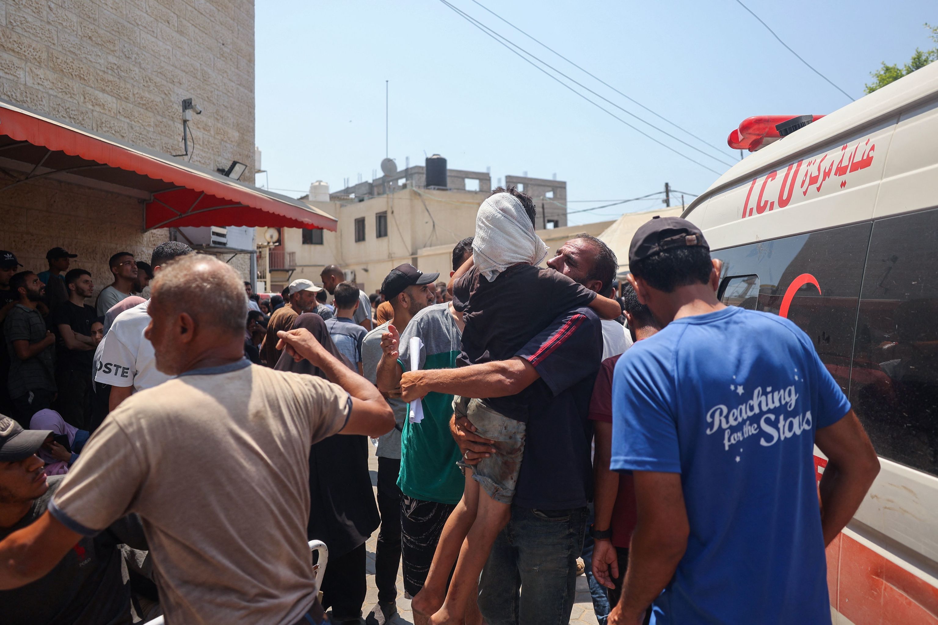 Palestinians transport casualties of Israeli bombardment to the Al-Aqsa Martyrs Hospital in Deir el-Balah in the central Gaza.