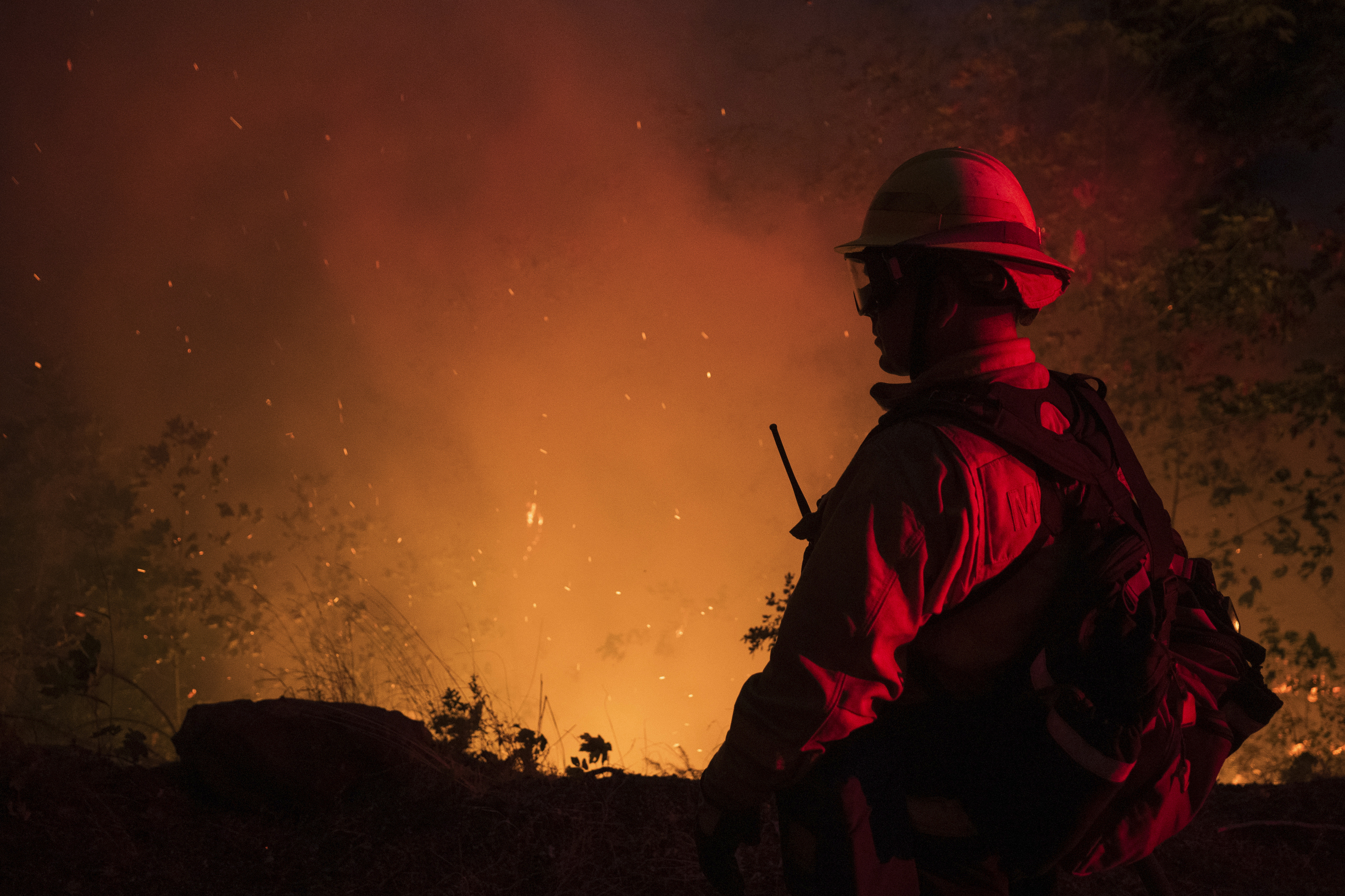 A firefighter from the city of Monterey monitors flareups from the Park Fire.