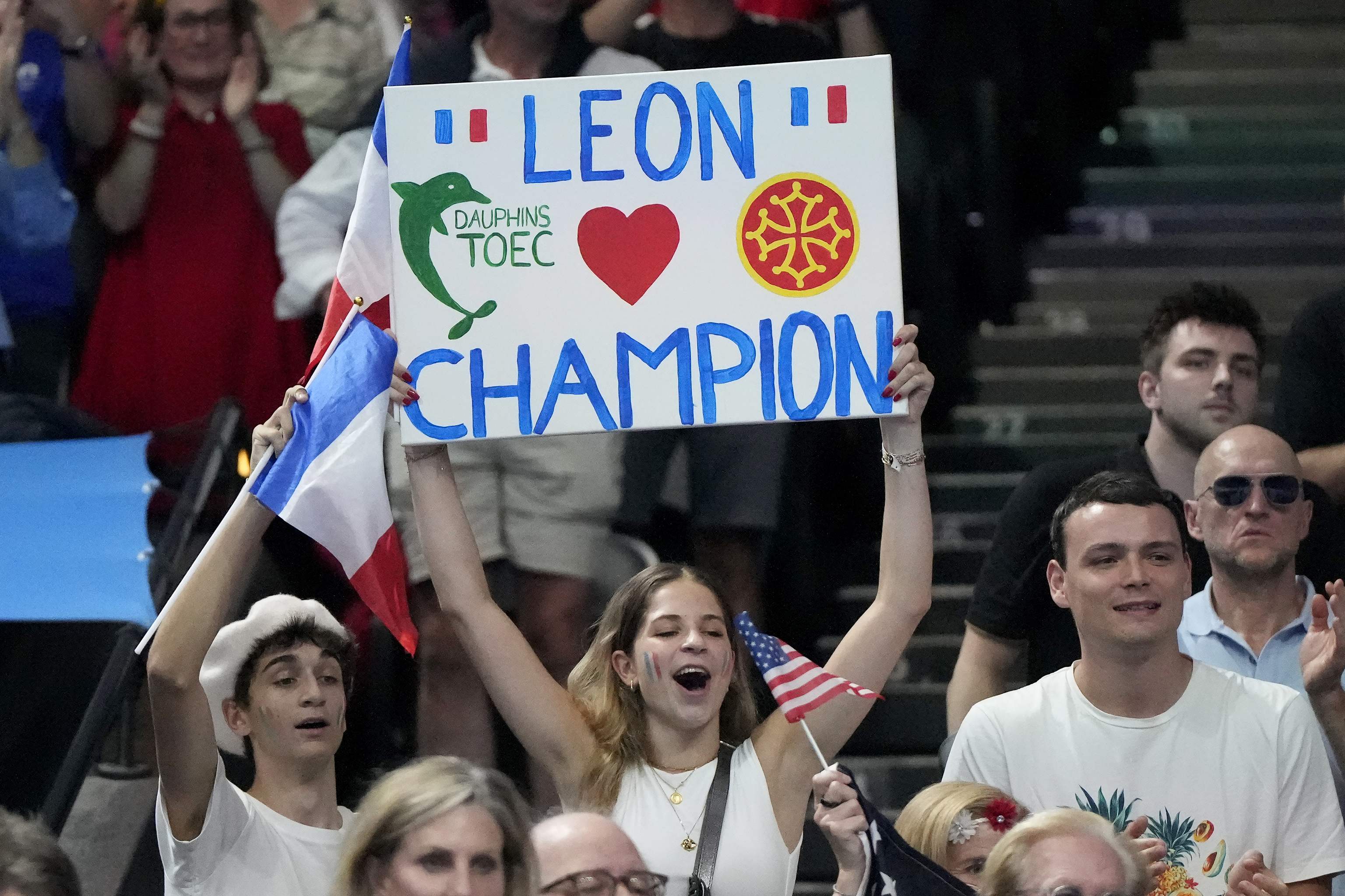 Supporters of gold medalist Leon Marchand.