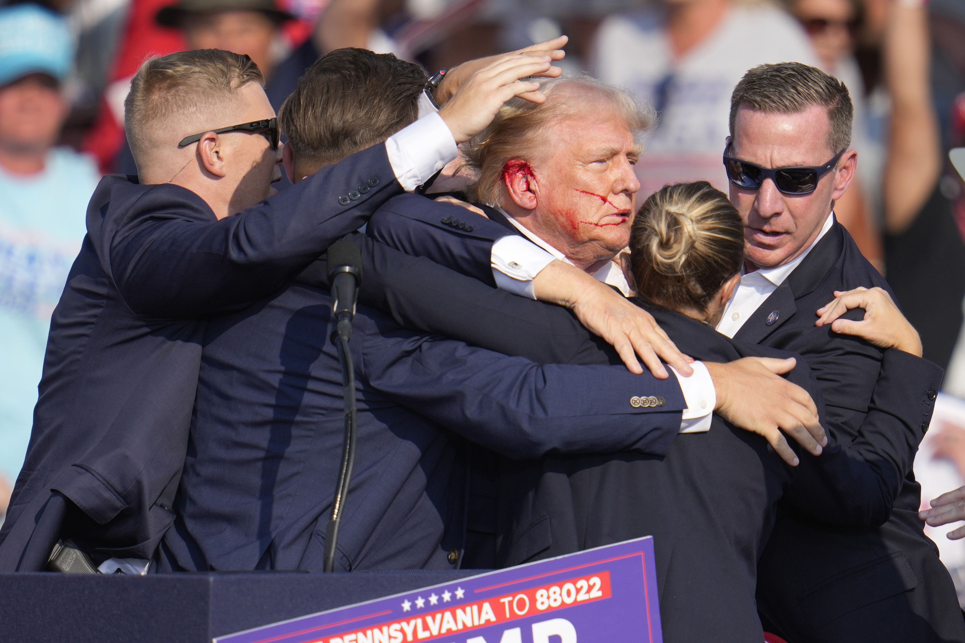 Republican presidential candidate former President Donald Trump is surrounded by U.S. Secret Service agents.