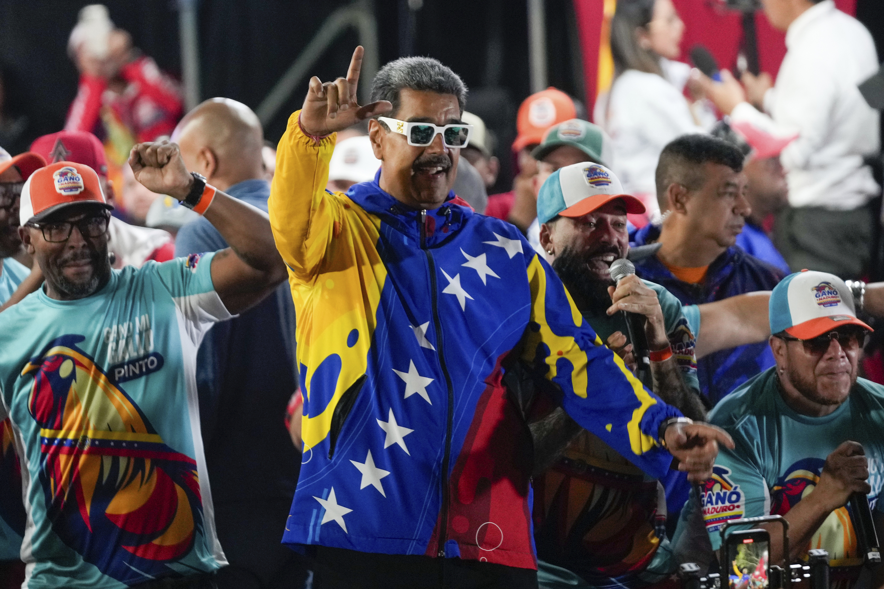 President Nicolas Maduro dances outside the Miraflores presidential palace.