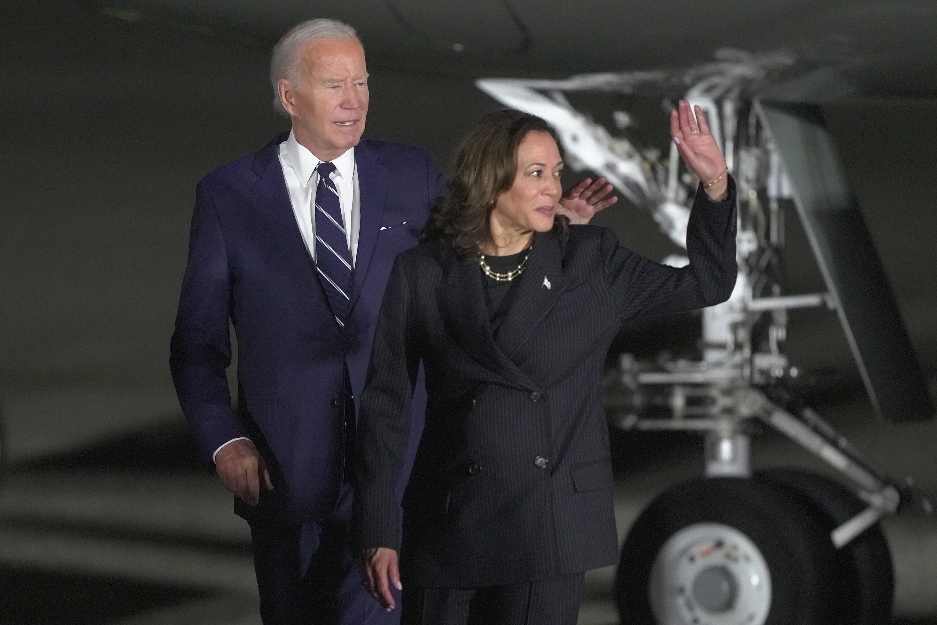 President Joe Biden and Vice President Kamala Harris walking across the tarmac after greeting reporter Evan Gershkovich, Alsu Kurmasheva and Paul Whelan.