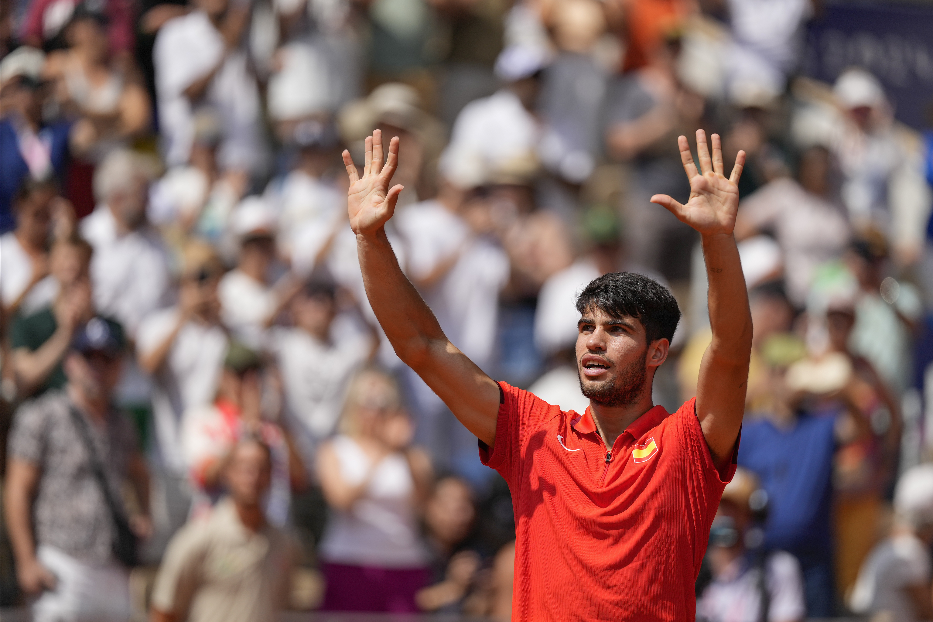 Carlos Alcaraz of Spain acknowledges the spectators after defeating Felix Auger-Aliassime of Canada.