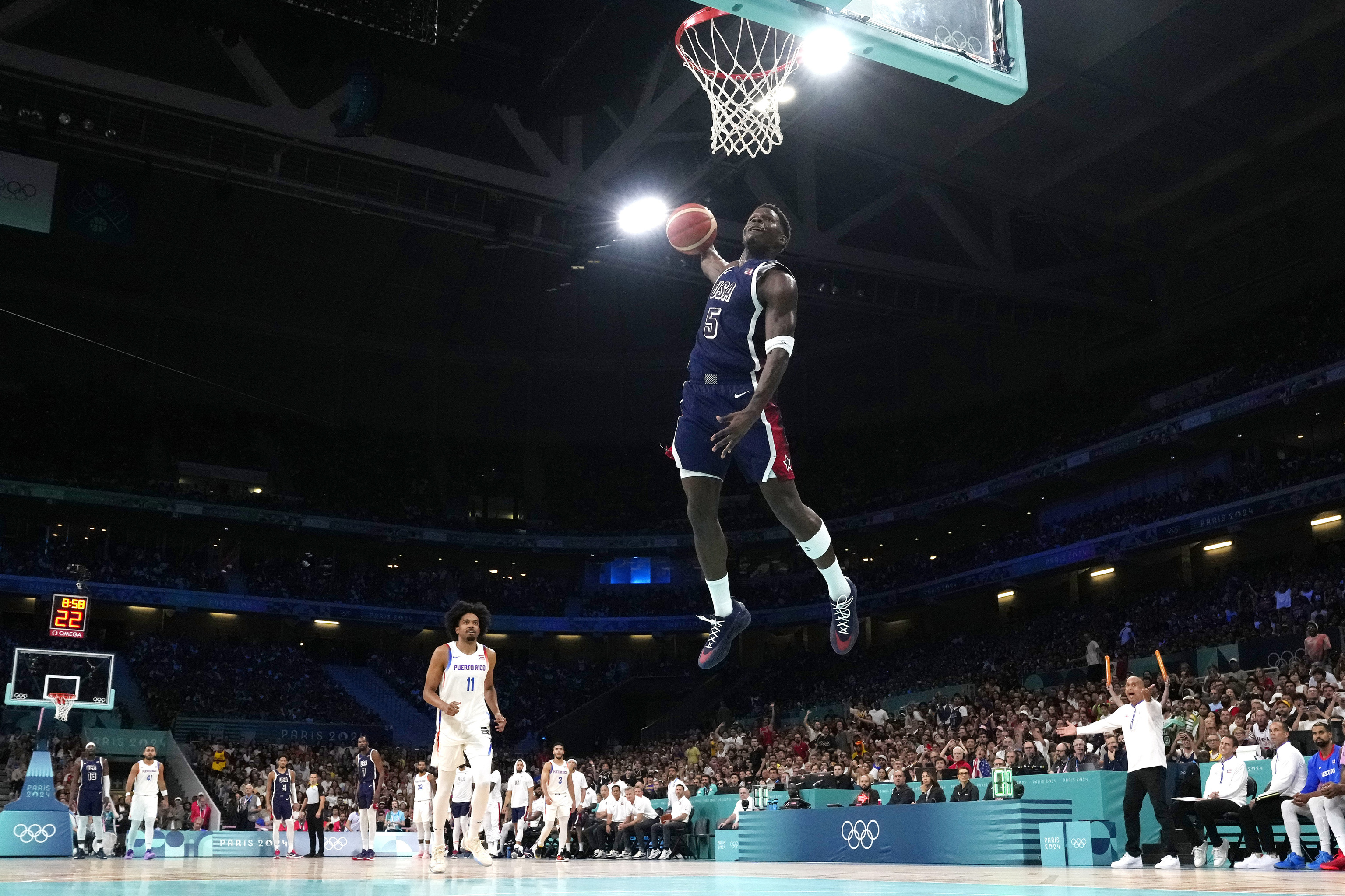 United States' Anthony Edwards, center, goes up for a dunk.