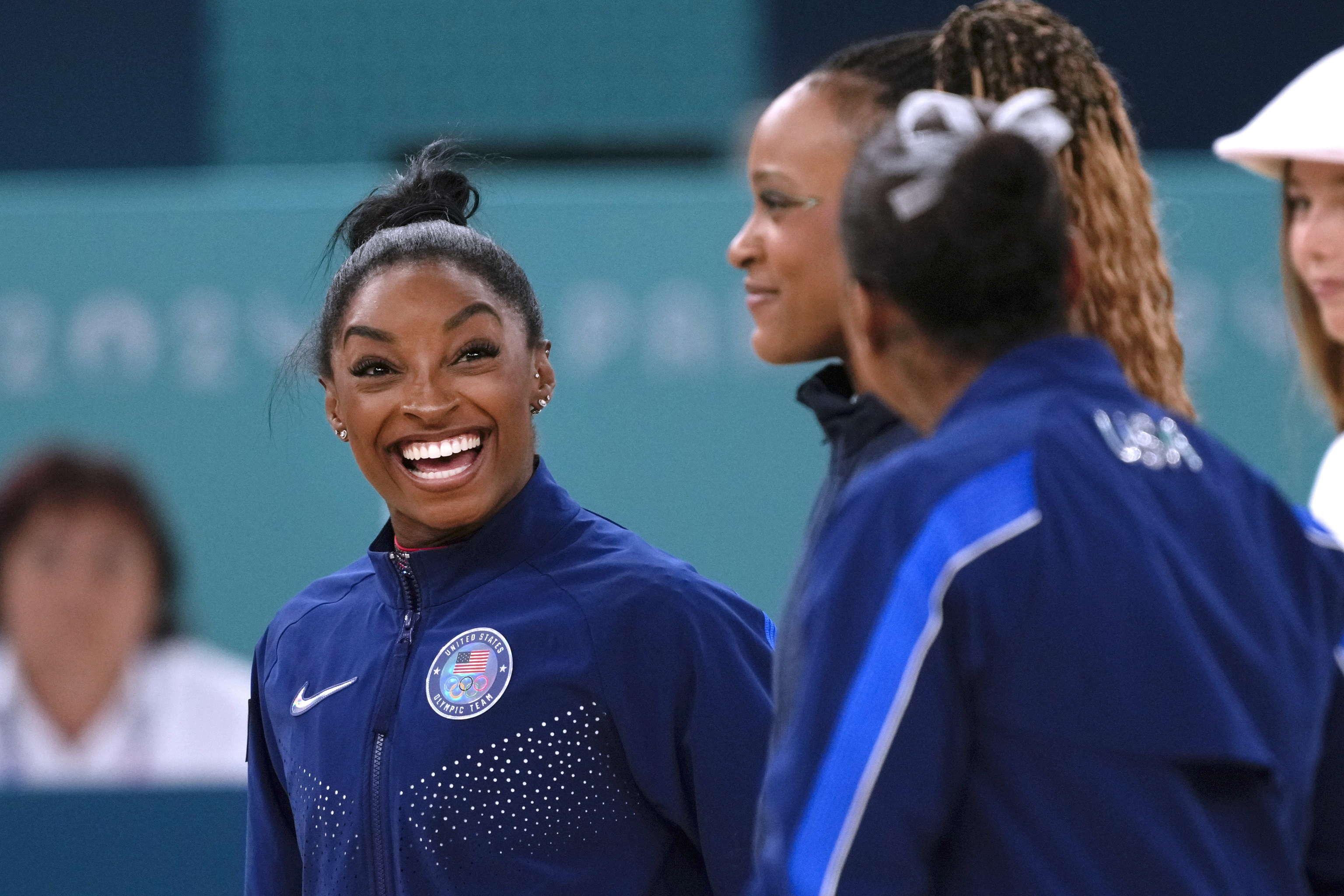 Simone Biles, of the United States, smiles after winning silver during the women's artistic gymnastics.