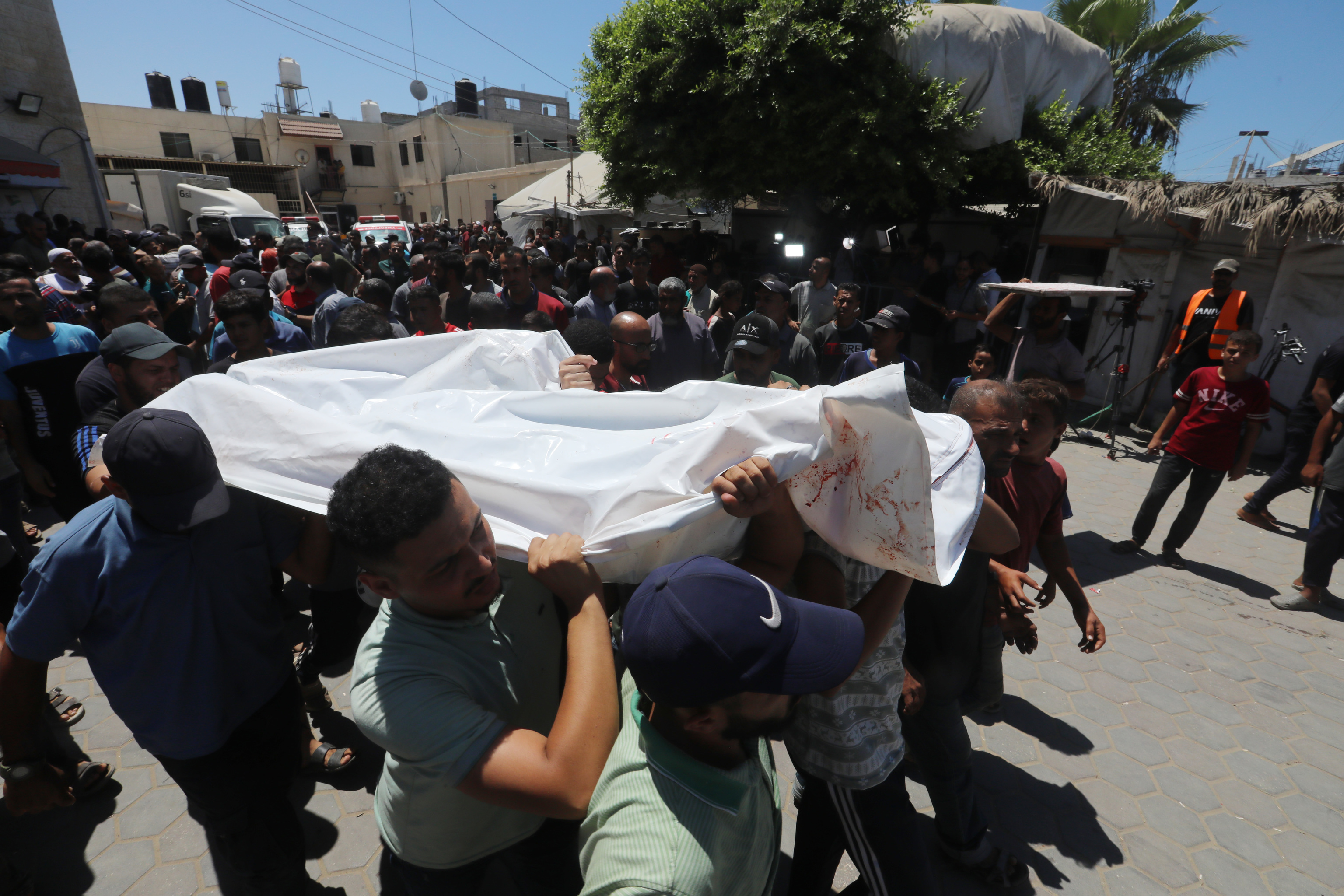 Relatives of the Palestinians died in Israeli attacks, mourn as they receive the dead bodies.