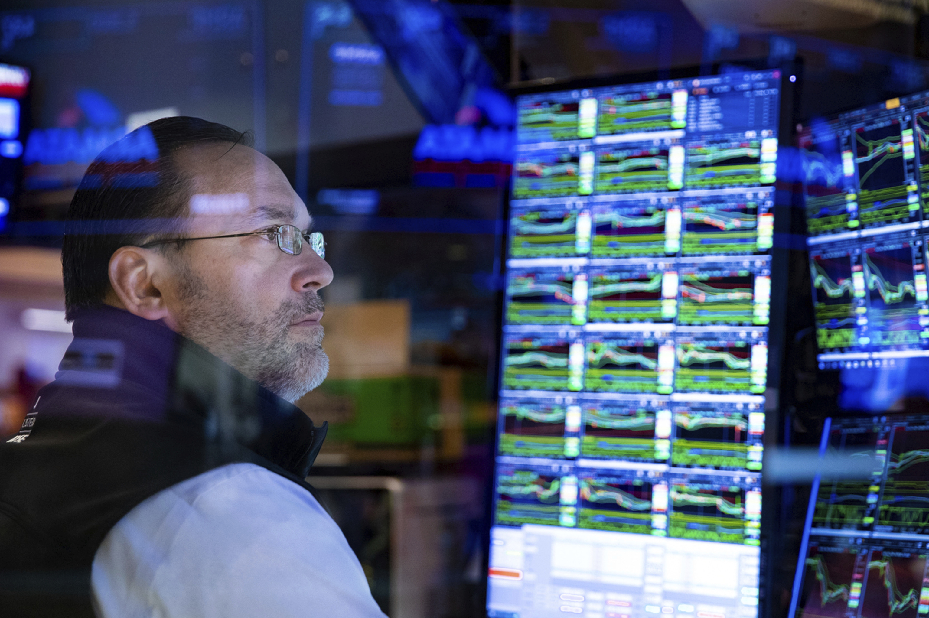 New York Stock Exchange, specialist Anthony Matesic works at his post on the trading floor.