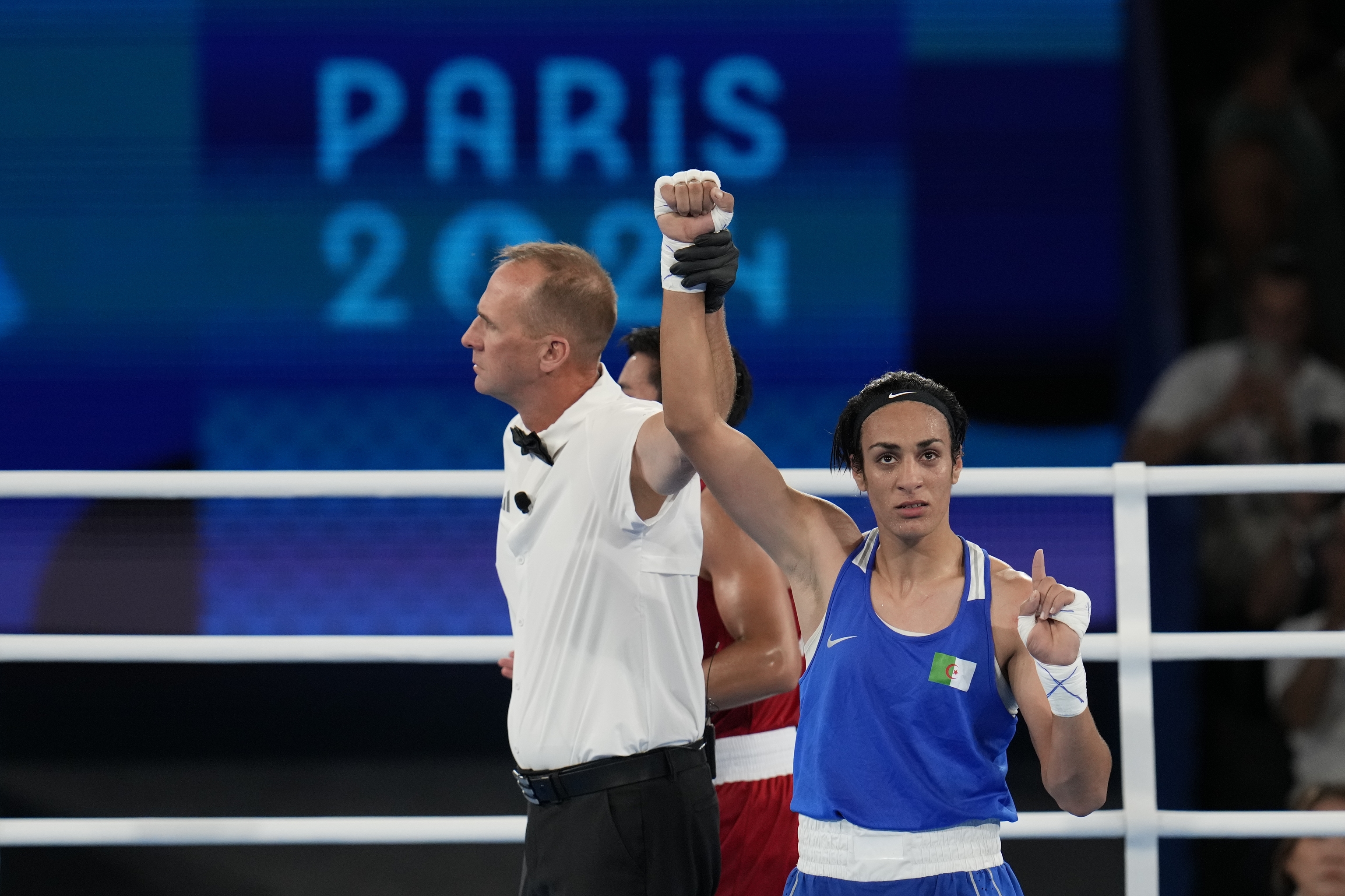 Algeria's Imane Khelif gestures after defeating Thailand's Janjaem Suwannapheng.