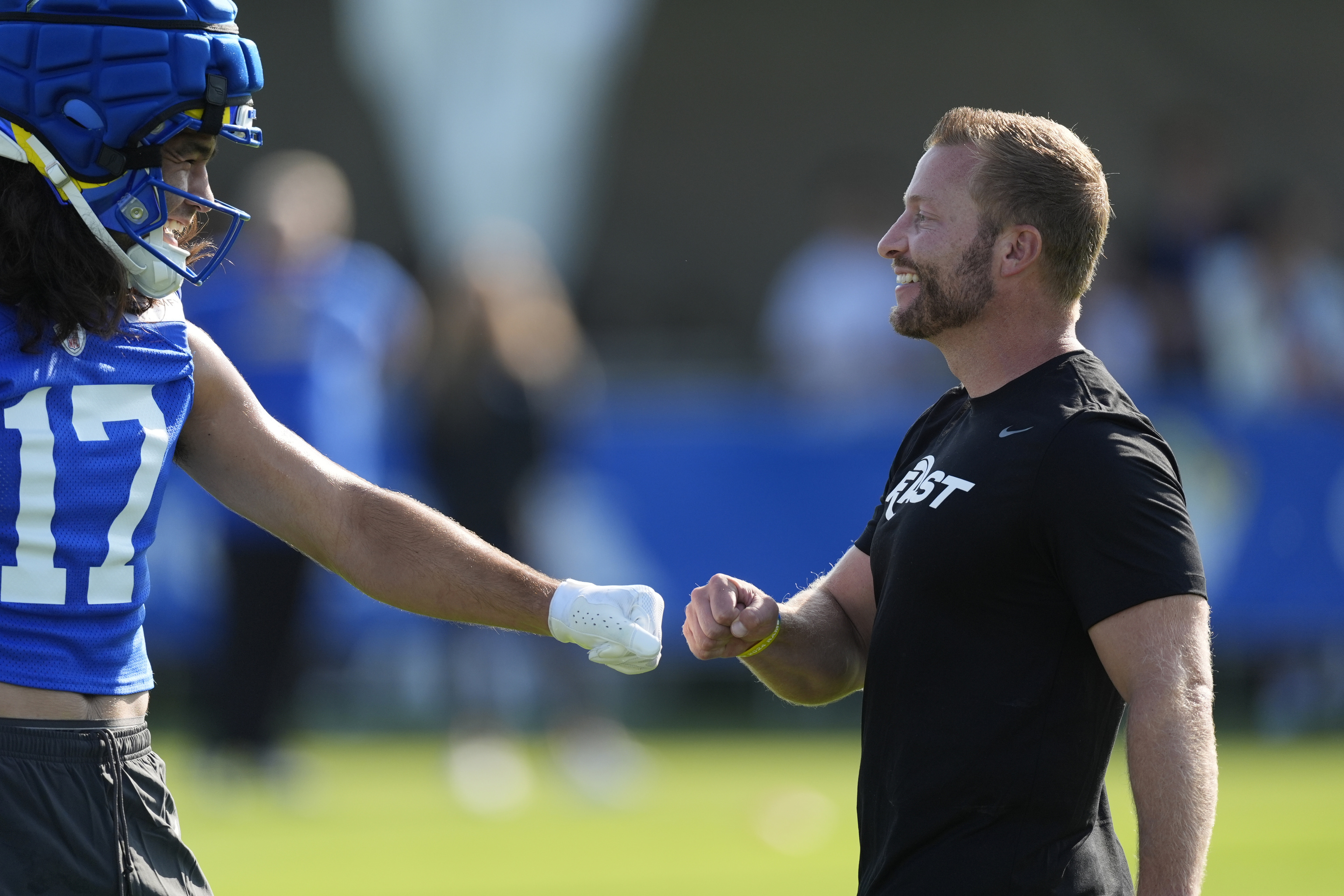 Los Angeles Rams wide receiver Puka Nacua (17) greets head coach Sean McVay