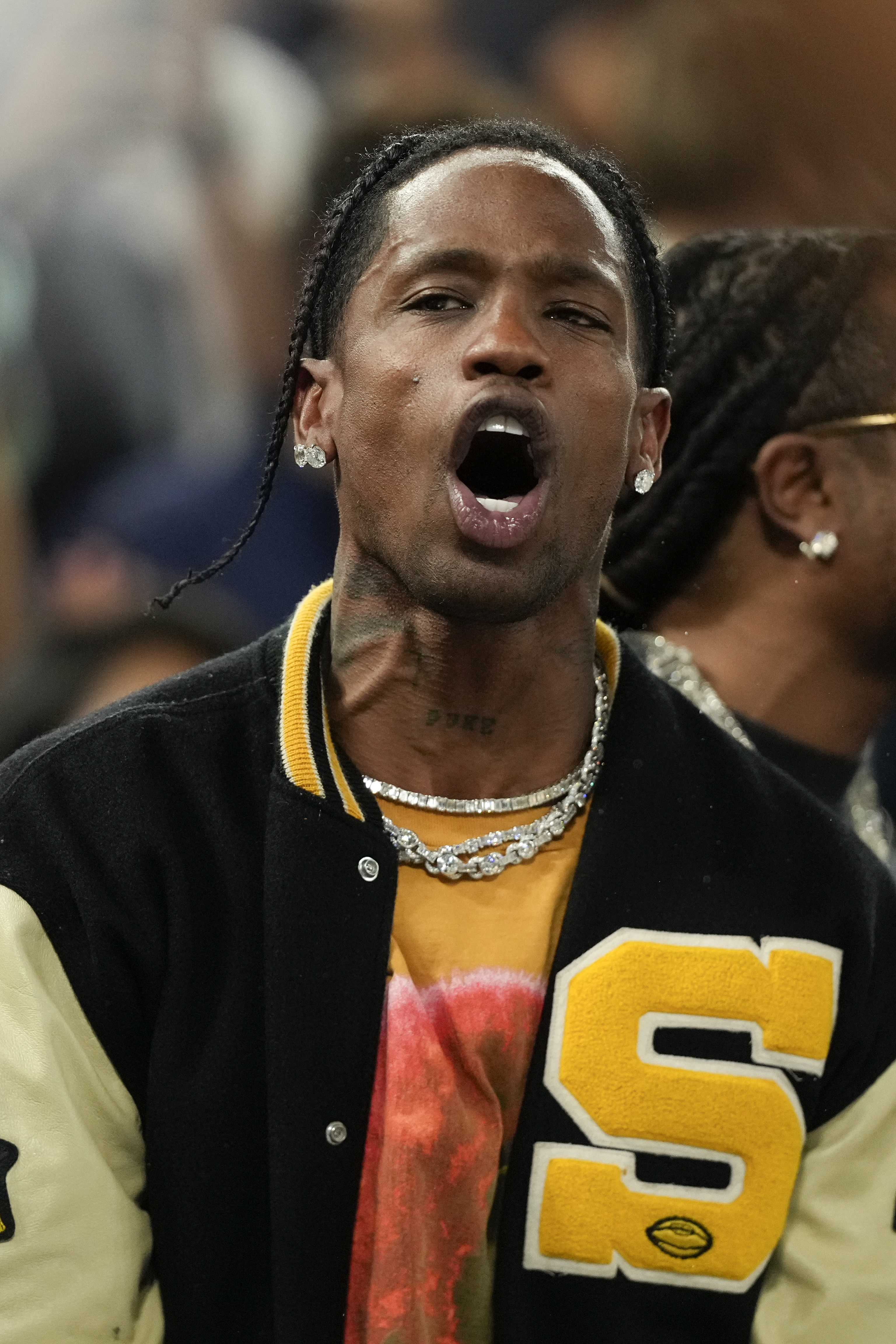 Travis Scott watches the Serbia vs' United States game