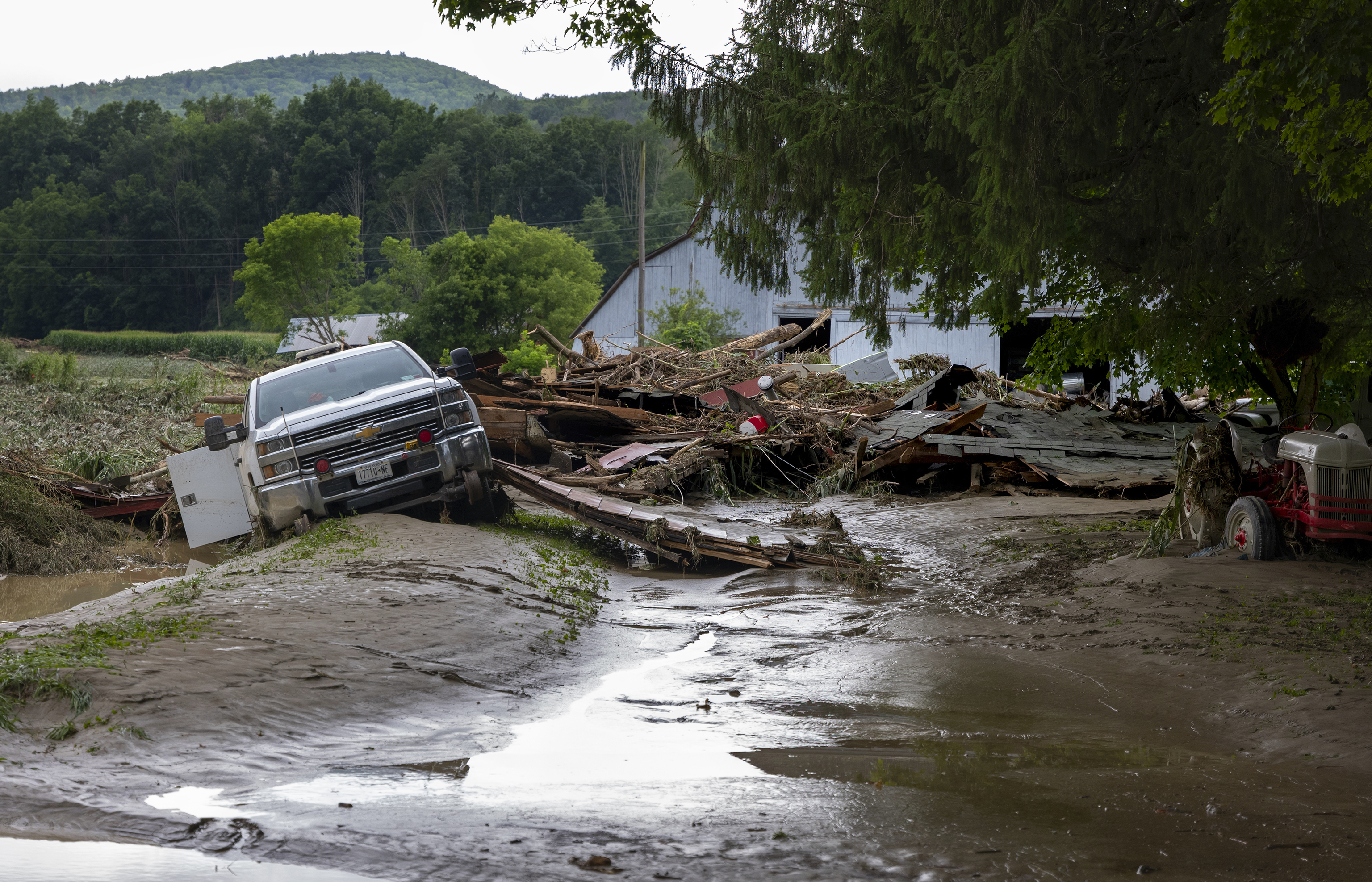 Debris on a farm property is destroyed in Canisteo,