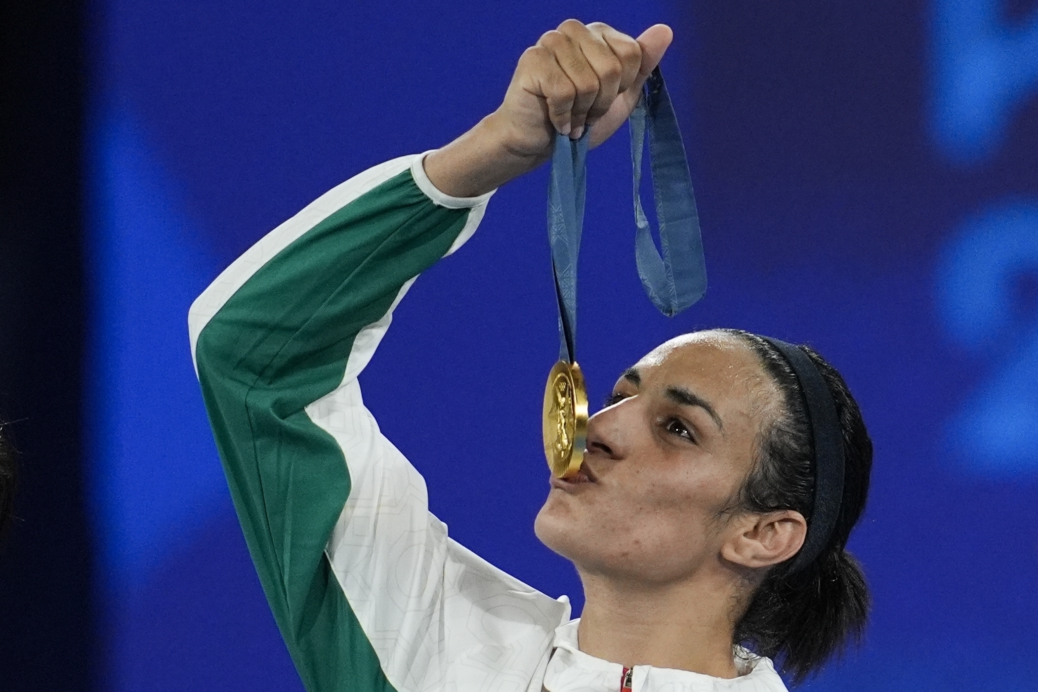 Gold medalist Algeria's Imane Khelif kisses her medal for the women's 66 kg final boxing match.