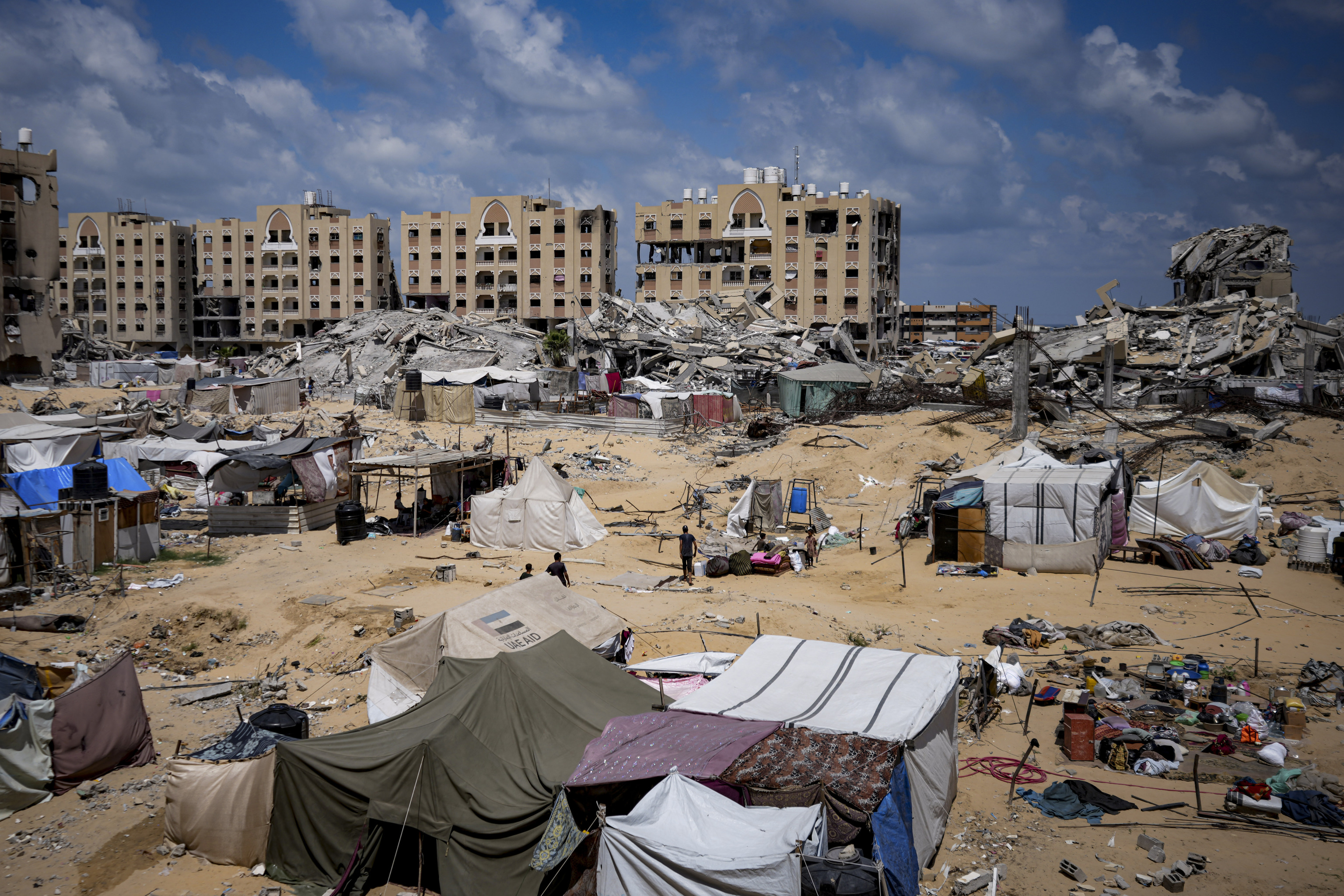 Palestinians displaced by the Israeli air and ground offensive on the Gaza Strip flee from Hamad City,