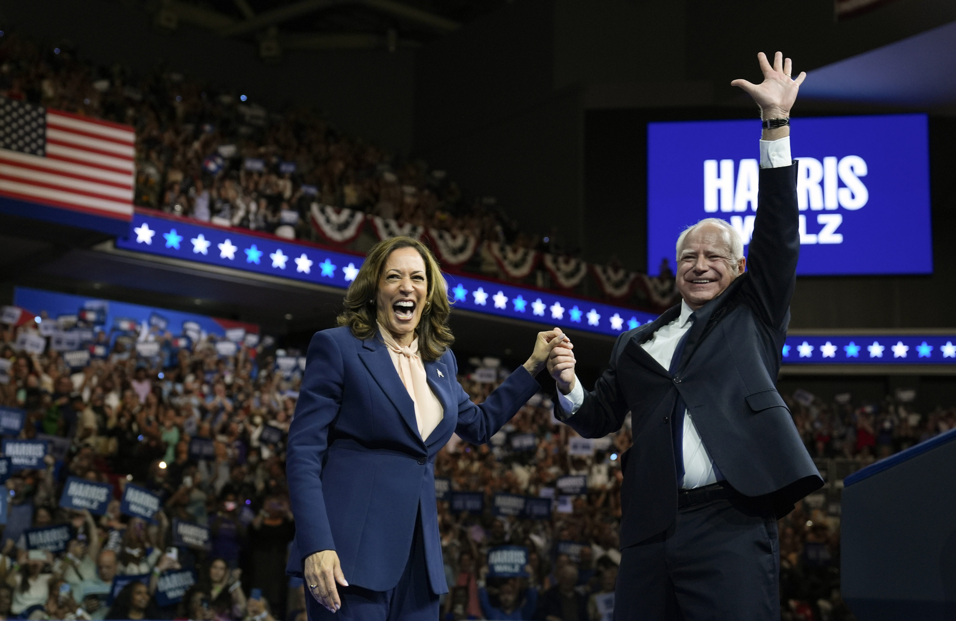 Democratic presidential nominee Vice President Kamala Harris accompanied, left, by her running mate Minnesota Gov. Tim Walz