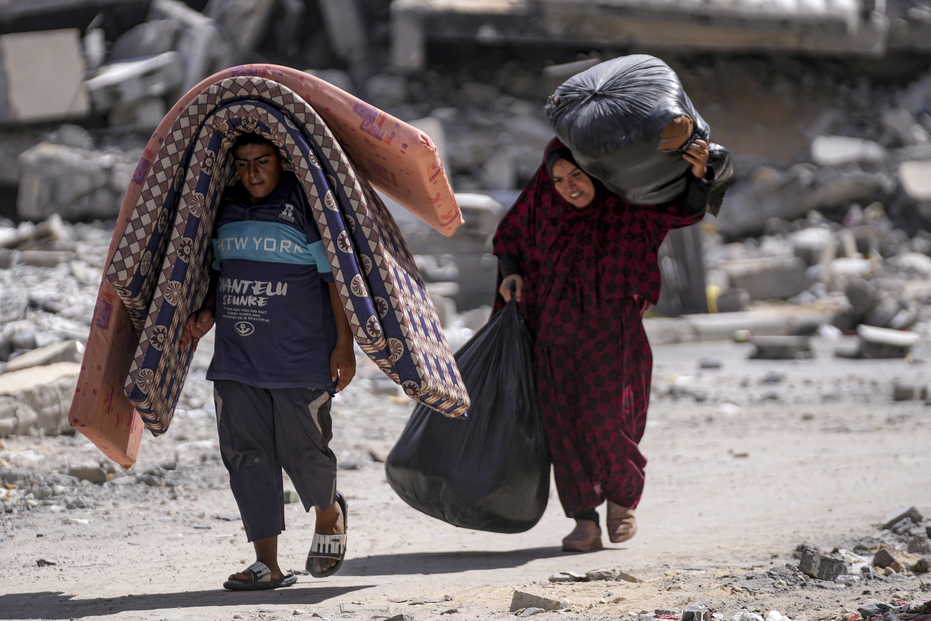 Palestinians displaced by the Israeli air and ground offensive on the Gaza Strip