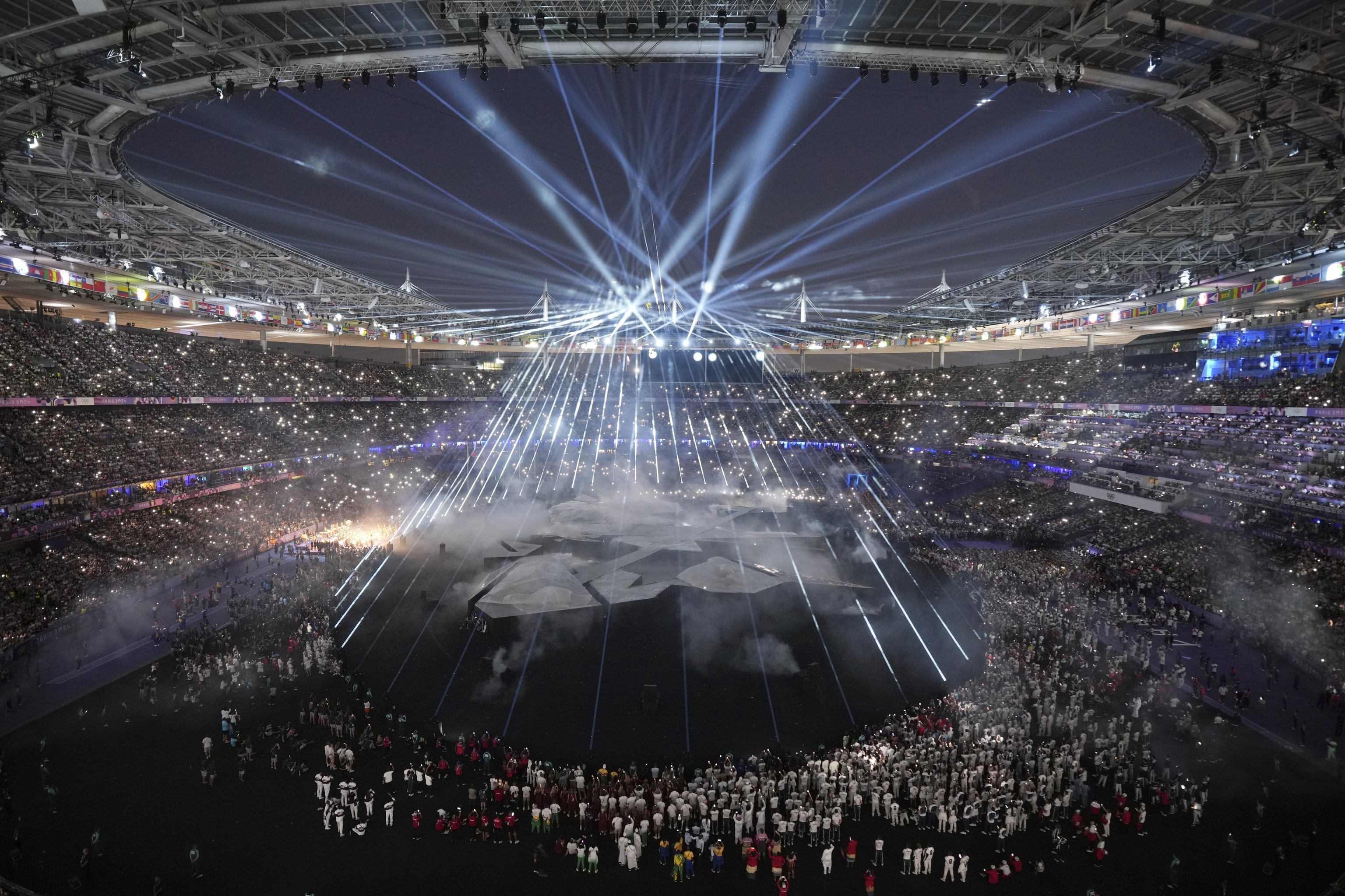 Participants attend the 2024 Summer Olympics closing ceremony.