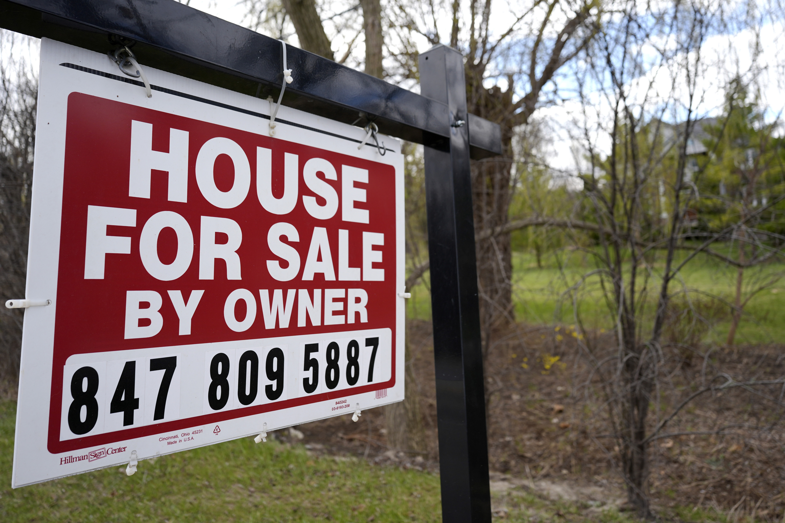 A sign announcing a house for sale is displayed in Prospect Heights