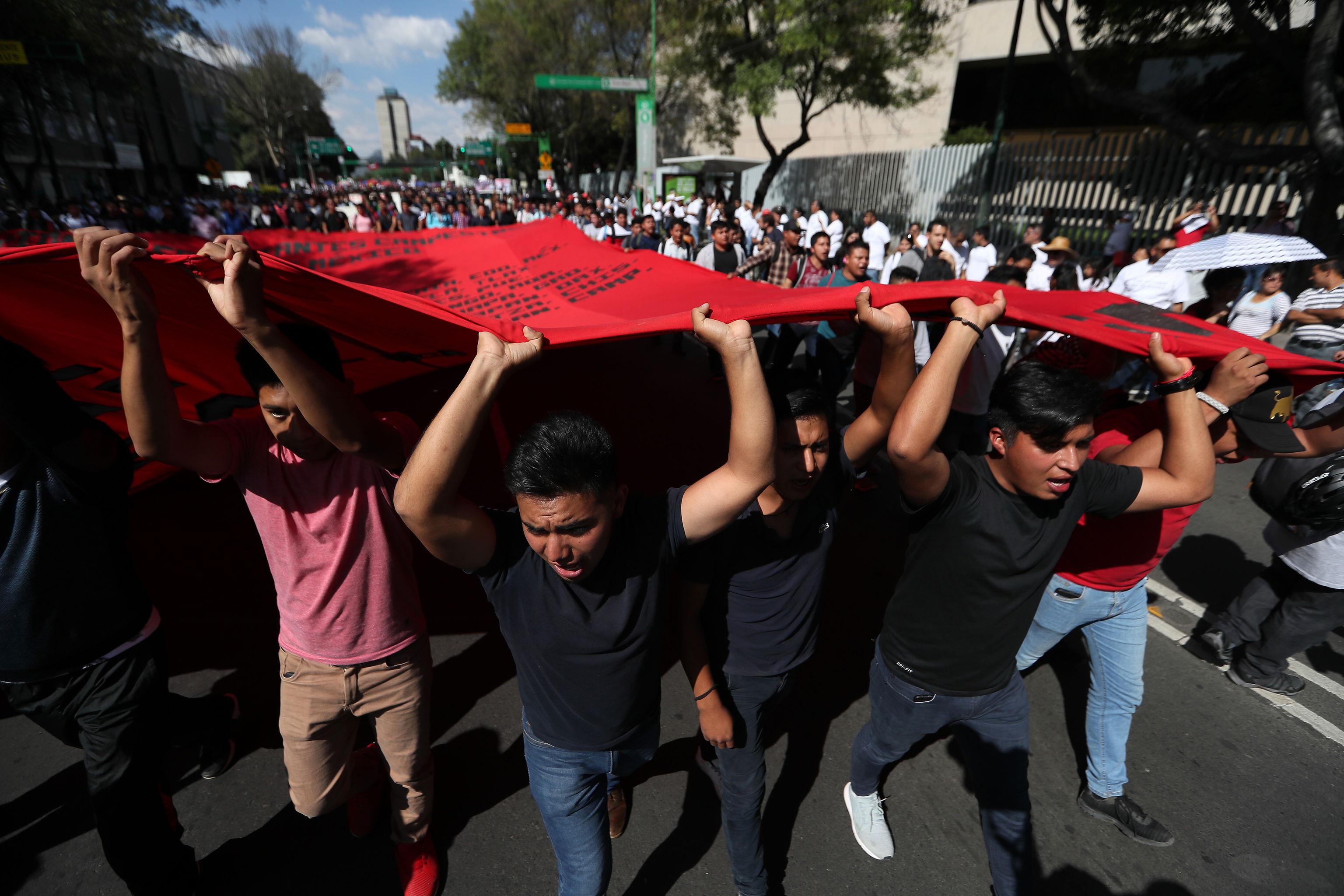 Demonstrators march in remembrance of the 1968 Tlatelolco student massacre