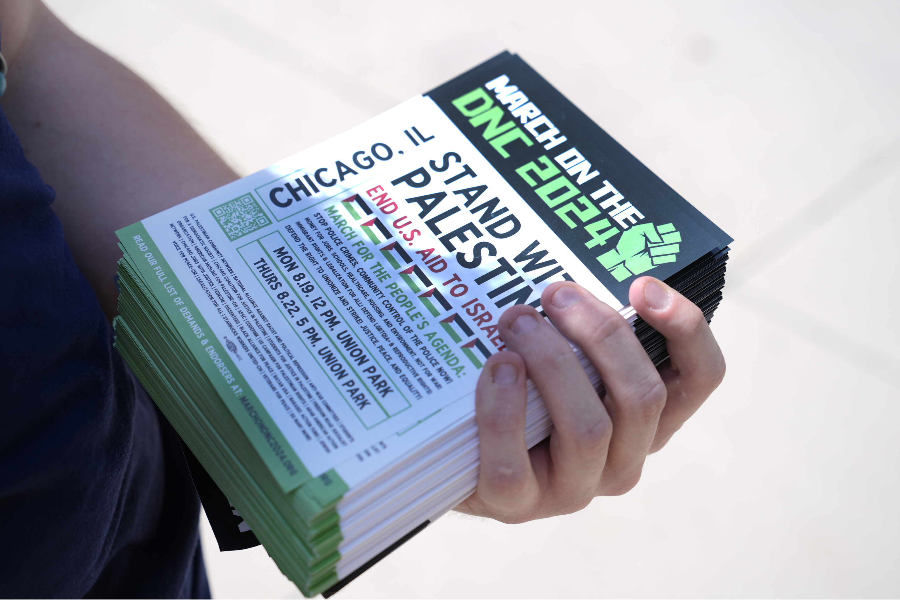 Activist Liz Rathburn holds flyers on the University of Illinois-Chicago campus about two pro-Palestinian marches