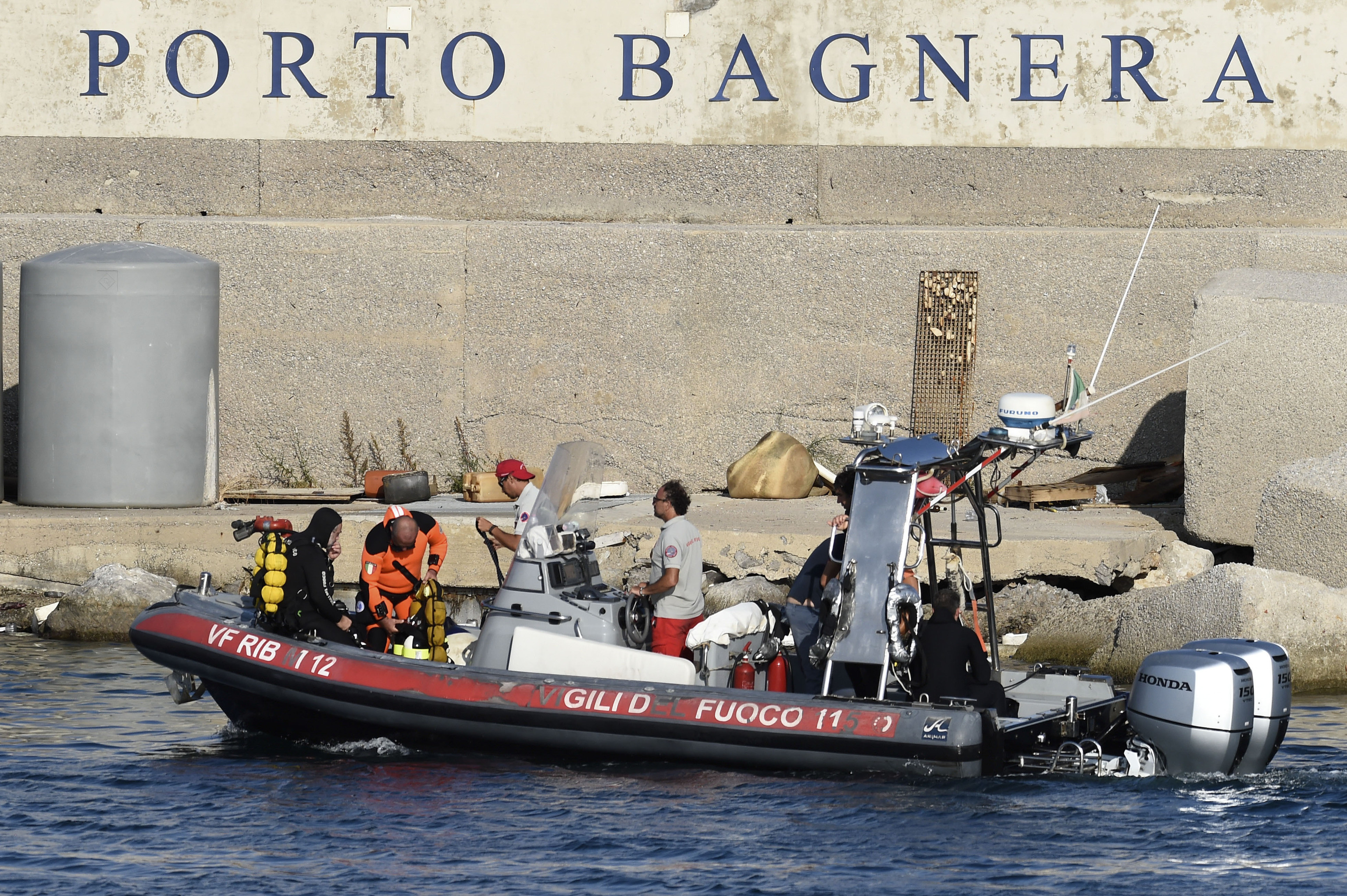 Rescue teams and divers returned to the site of a storm-sunken superyacht