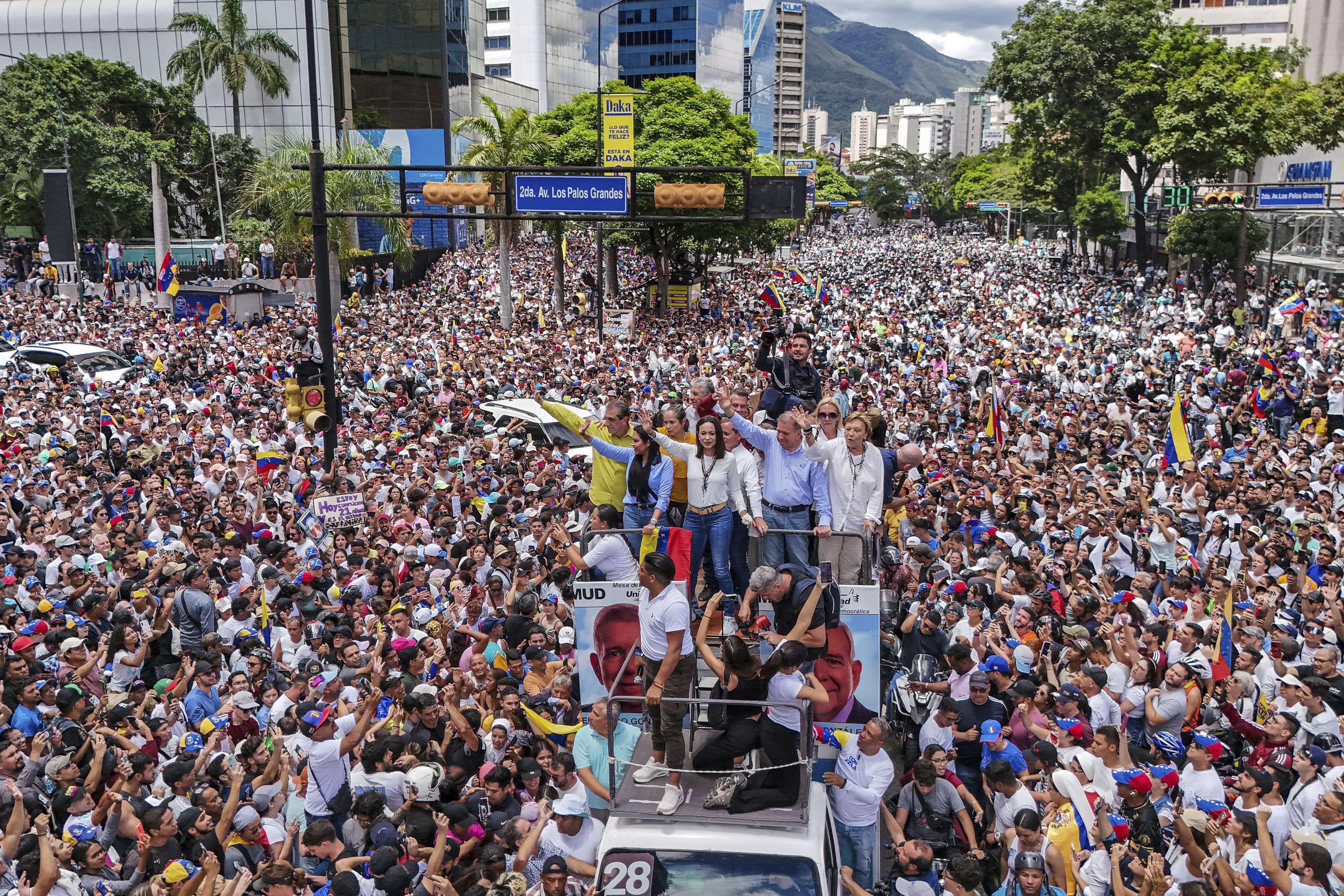 pposition leader Maria Corina Machado and opposition candidate Edmundo Gonzalez ride atop a truck during a protest against official presidential election results declaring President Nicolas Maduro