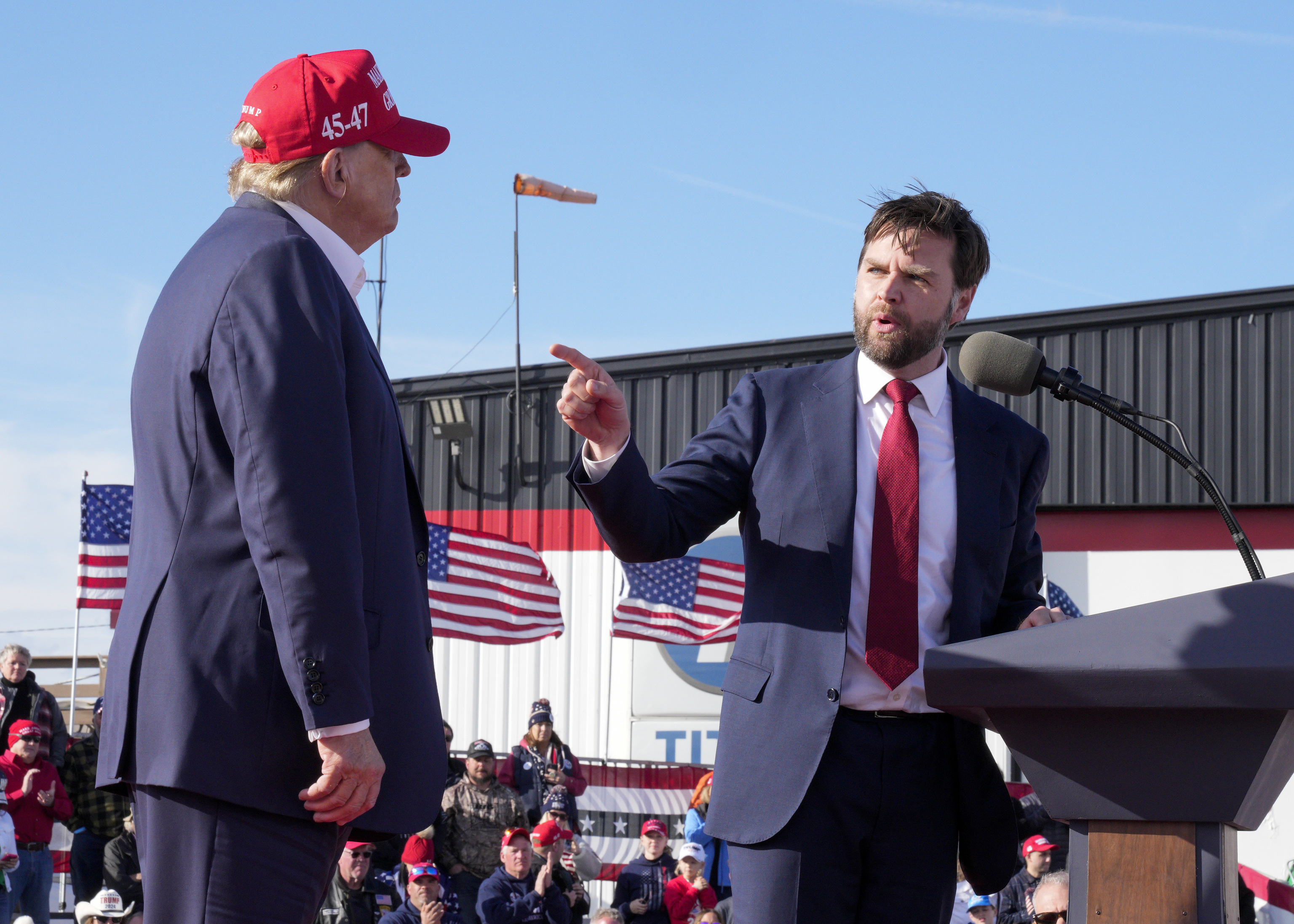 Sen. J.D. Vance, R-Ohio, right, points toward Republican presidential candidate former President Donald Trump at a campaign rally,