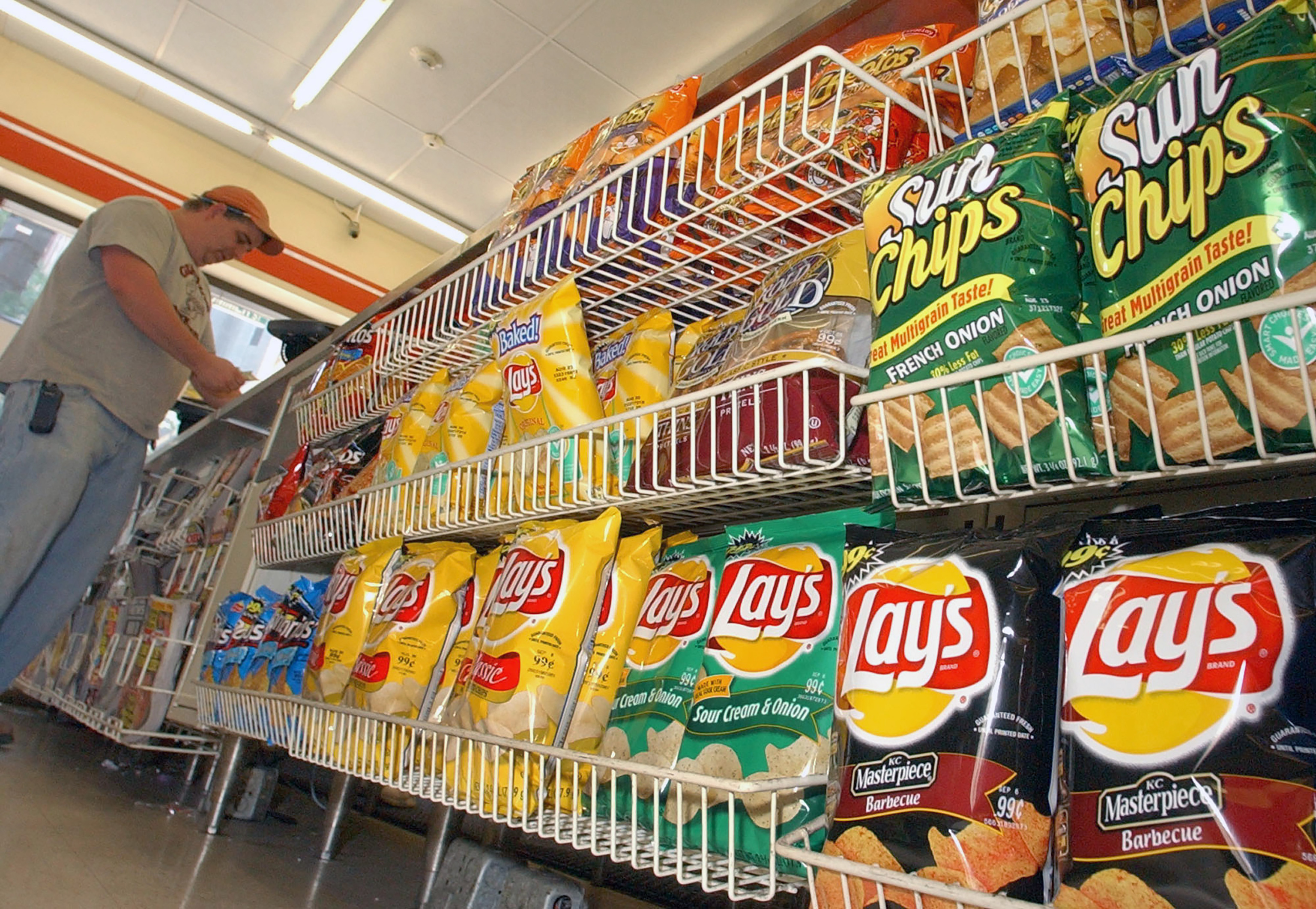 A customer makes a purchase at a convenience store in Boston