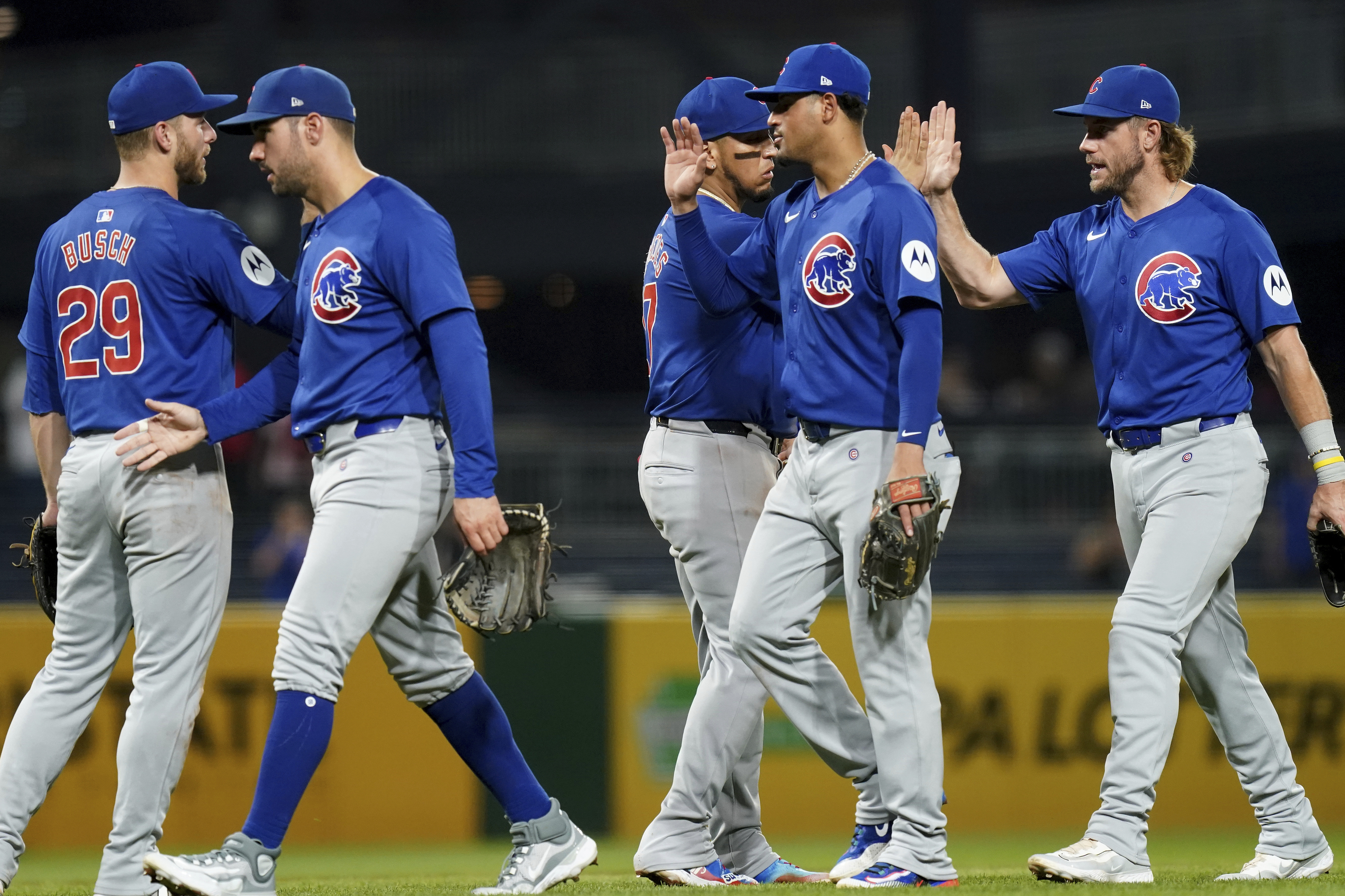 Chicago Cubs teammates celebrate their win over the Pittsburgh Pirates