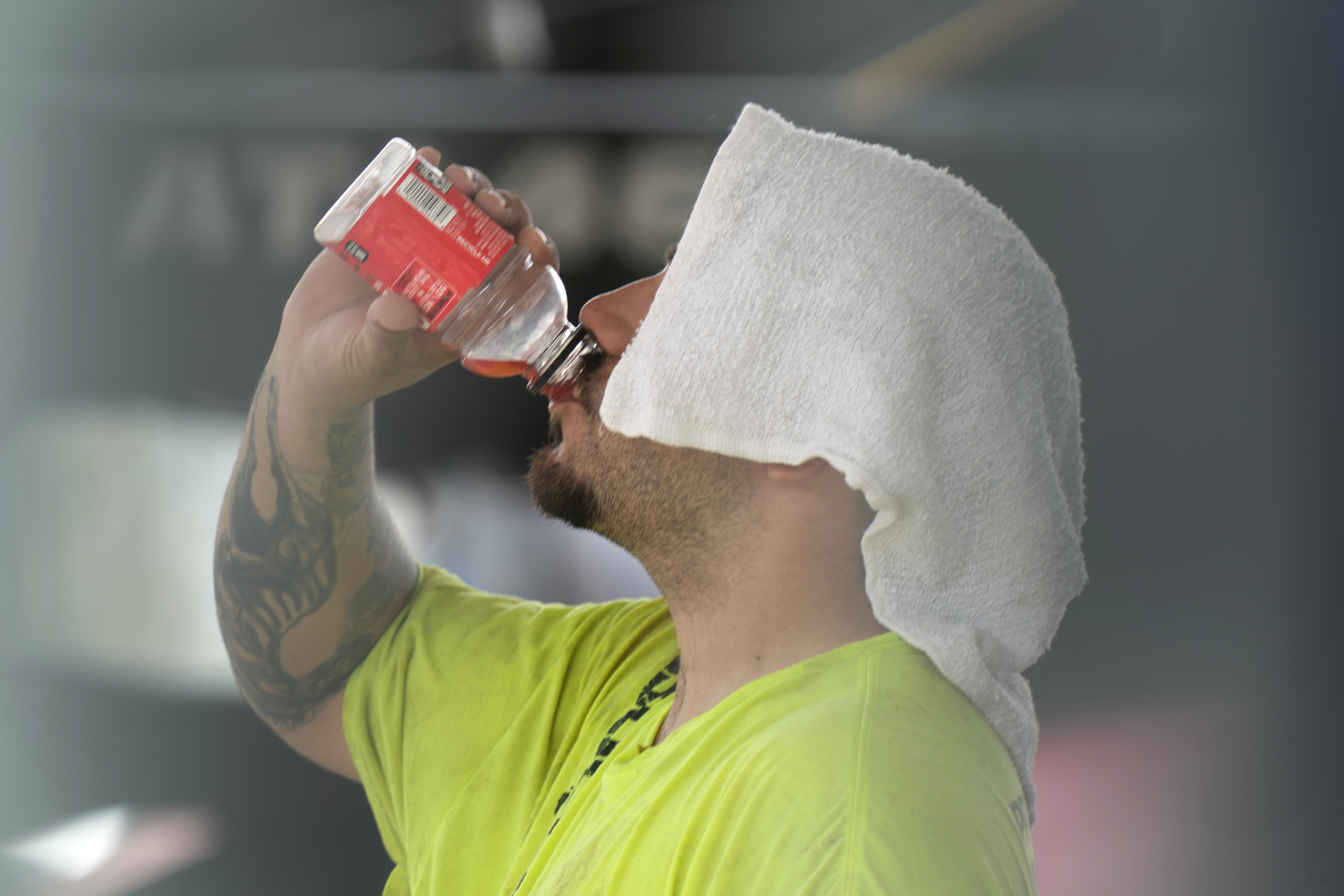 A construction worker hydrates at the Shedd Aquarium