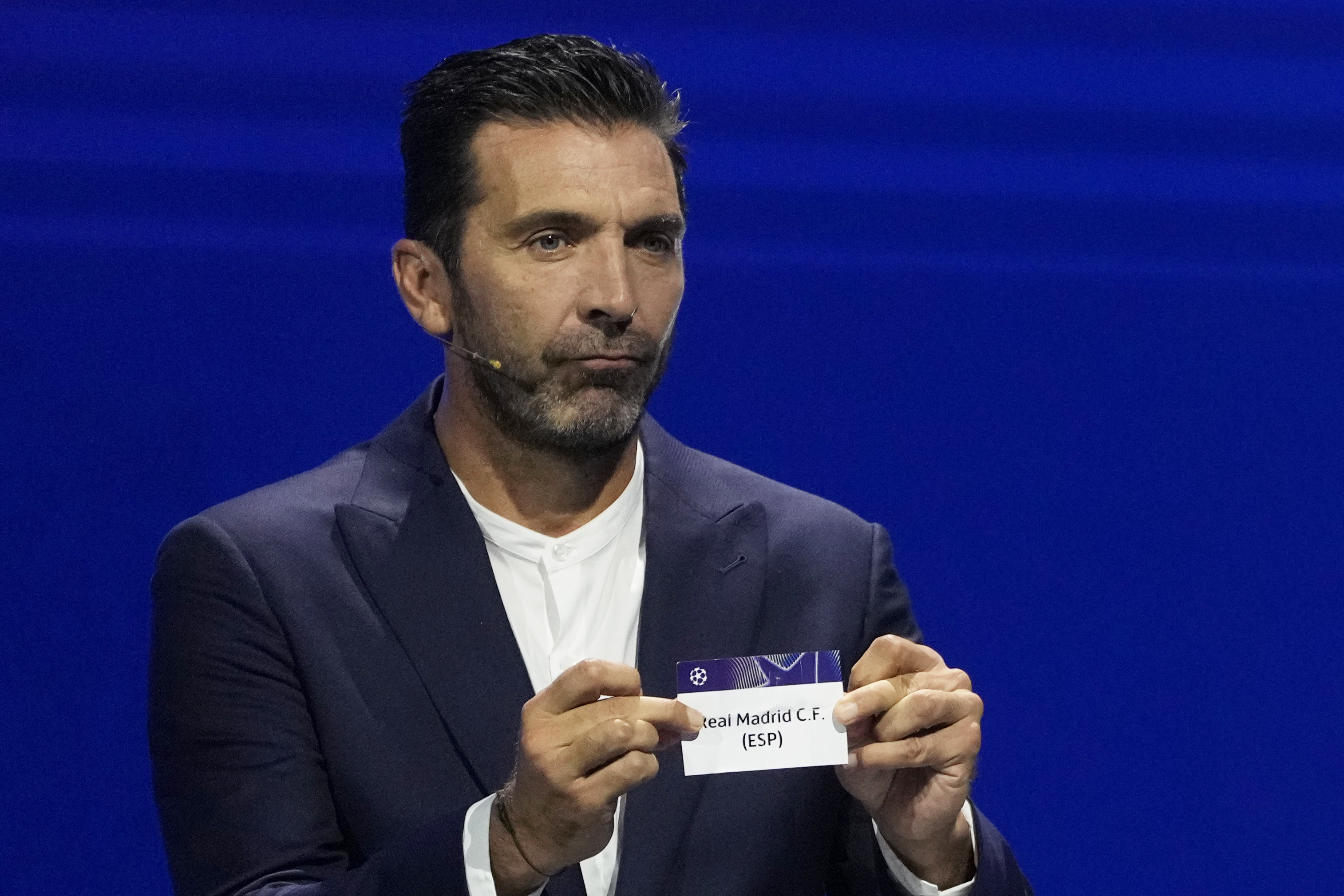 ormer Italian goalkeeper Gianluigi Buffon holds a ticket for Real Madrid during the Champions League