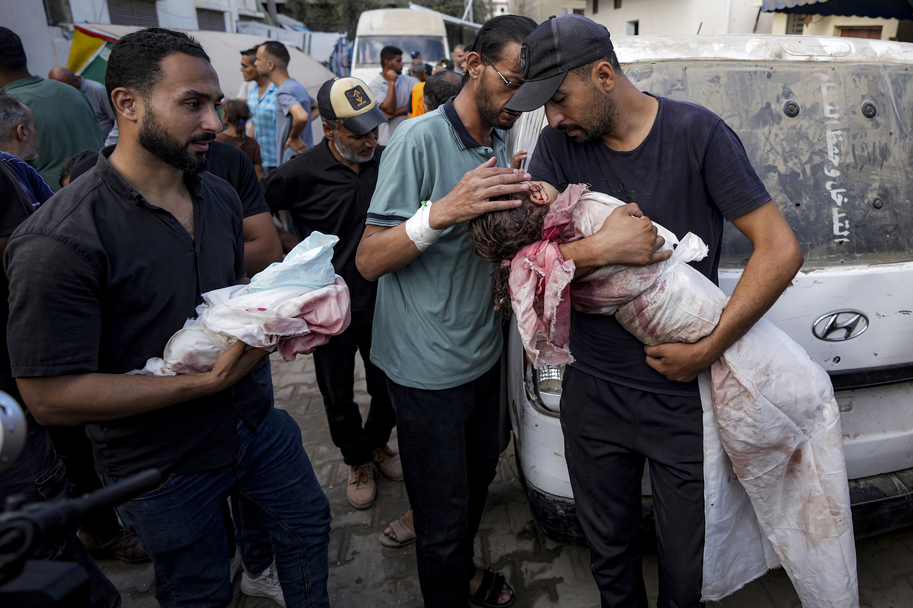 Relatives mourn children killed in the Israeli bombardment of the Gaza Strip