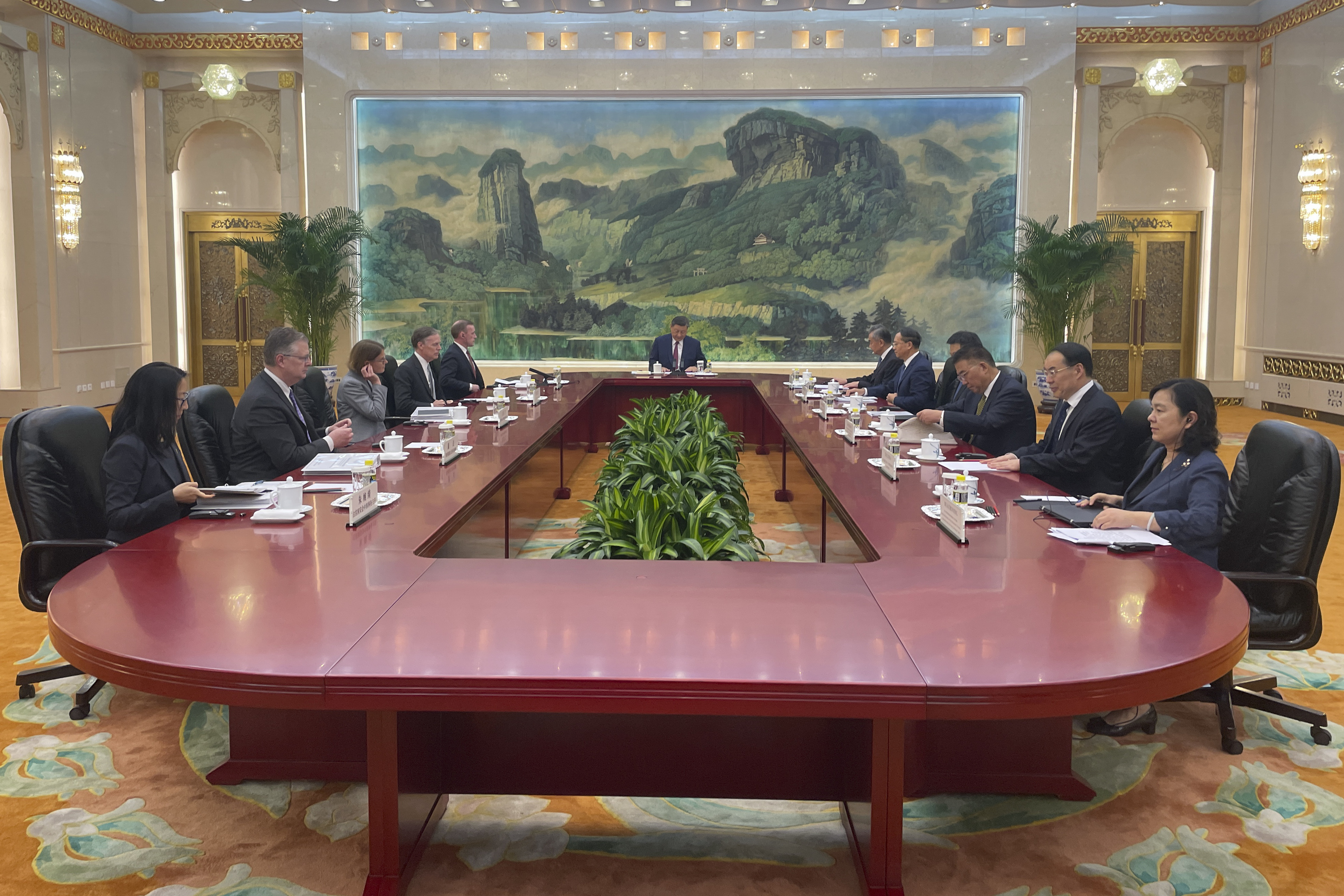 White House national security adviser Jake Sullivan, rear left, accompanied by U.S. Ambassador to China Nicholas Burns meets Chinese President Xi Jinping