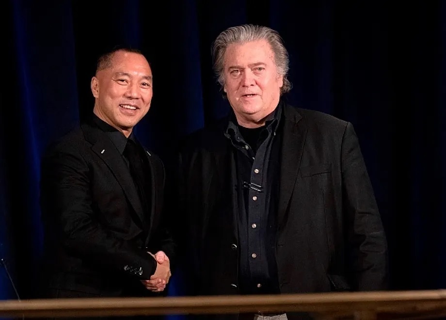 Former White House chief strategist Steve Bannon greets Guo Wengui in a 2018.