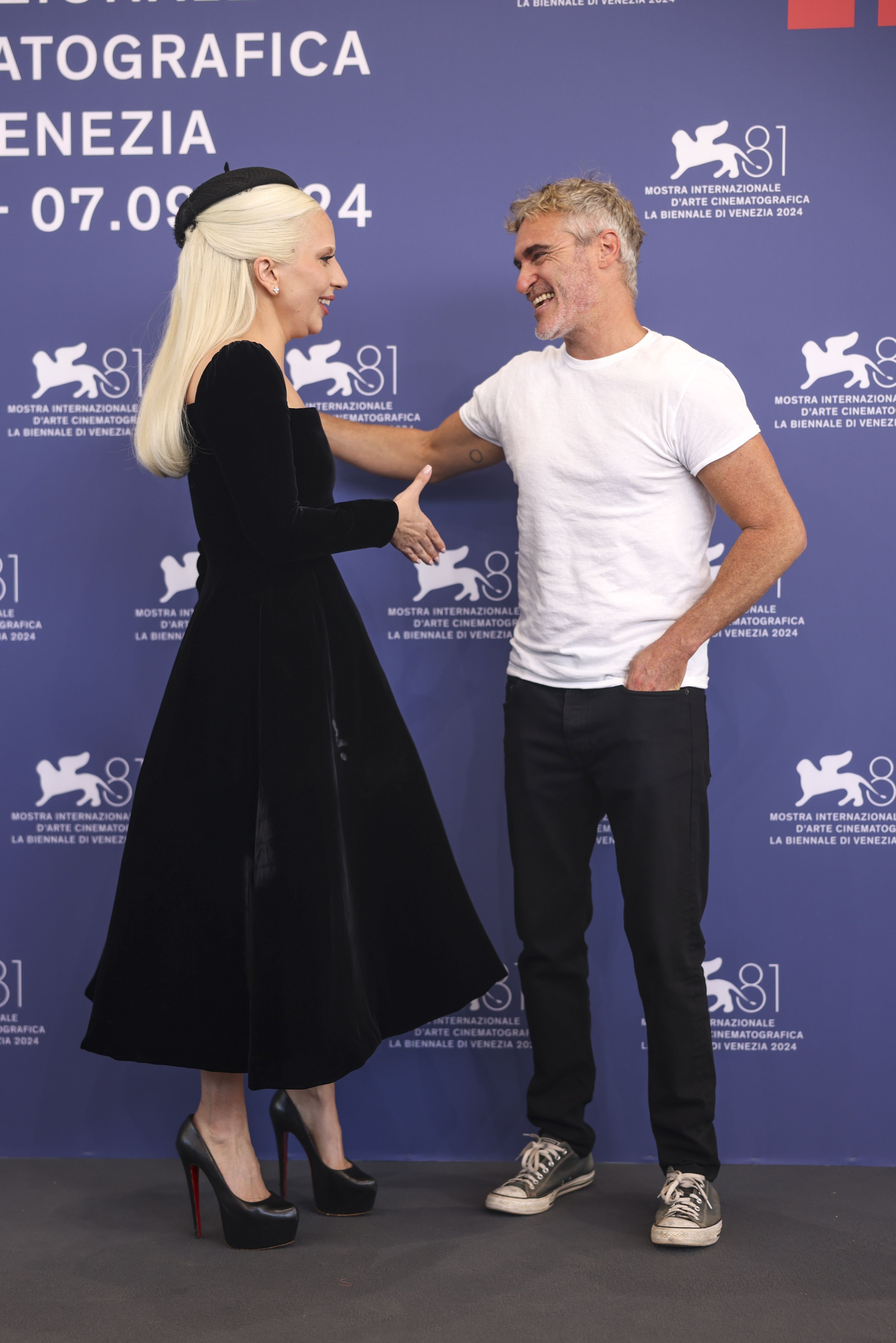 Lady Gaga, left, and director Todd Phillips pose for photographers at the photo call for the film 'Joker: