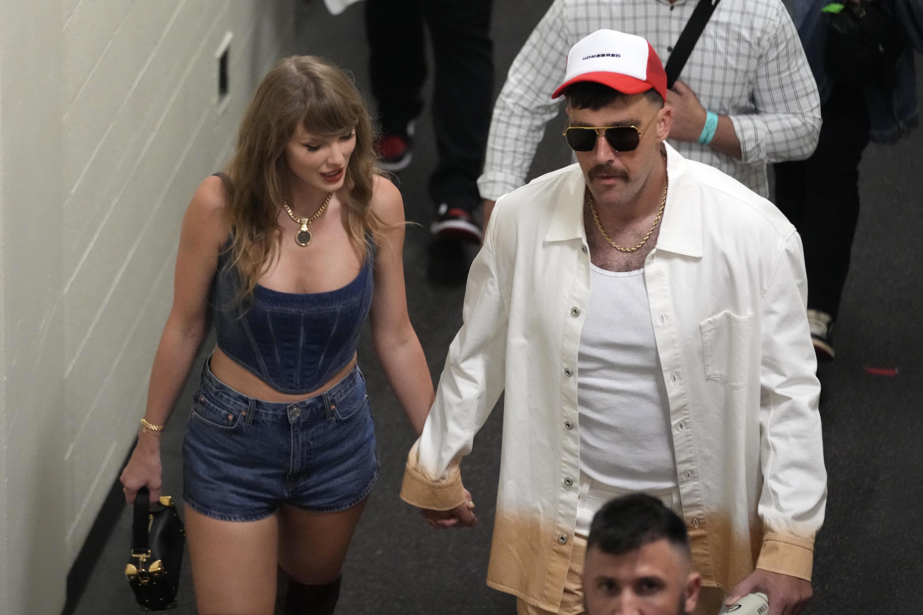 Travis Kelce and Taylor Swift following an NFL football game.