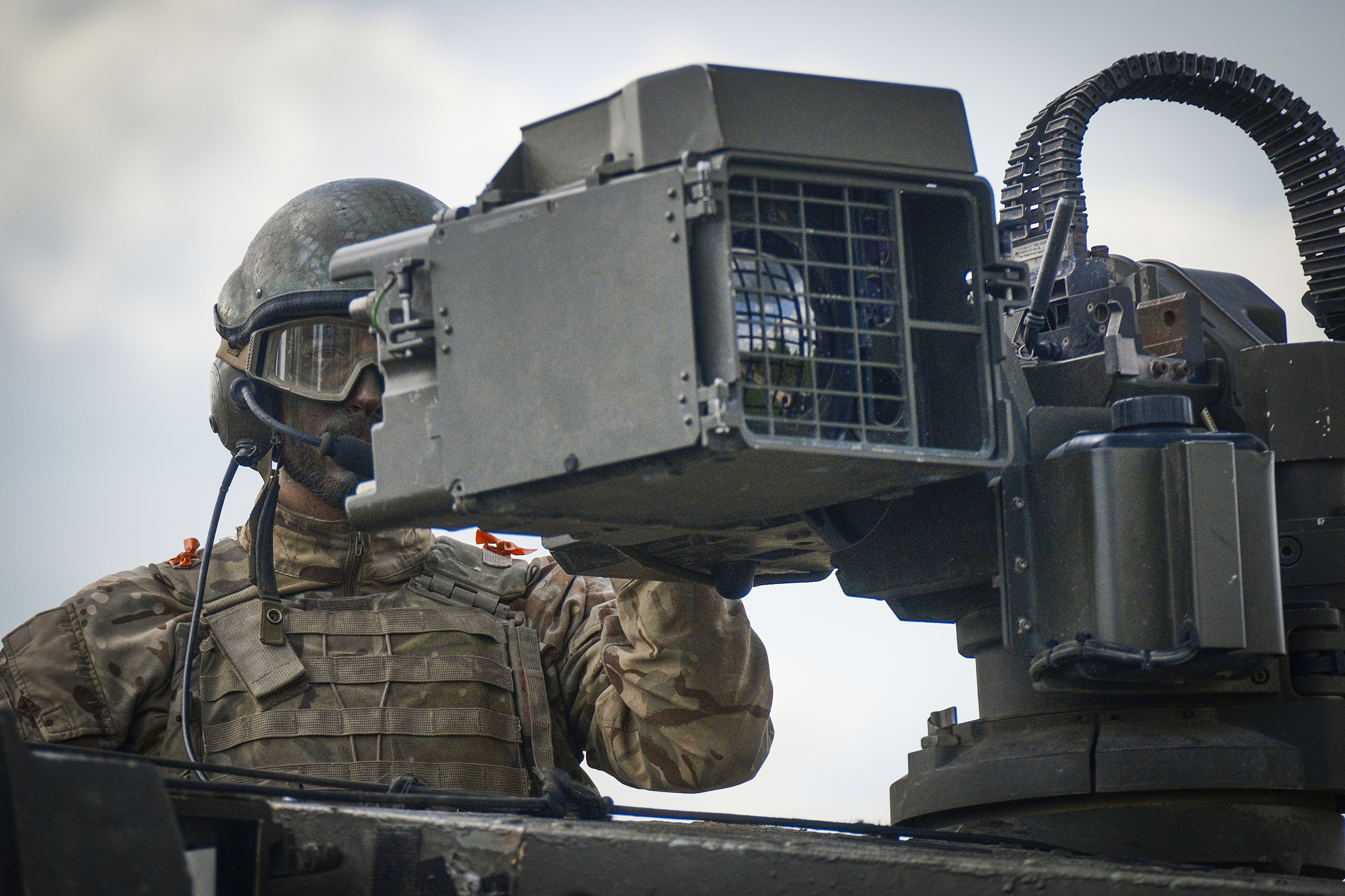 A soldier sits atop a Challenger 2 main battle tank of the British forces during the NATO's Spring Storm exercise