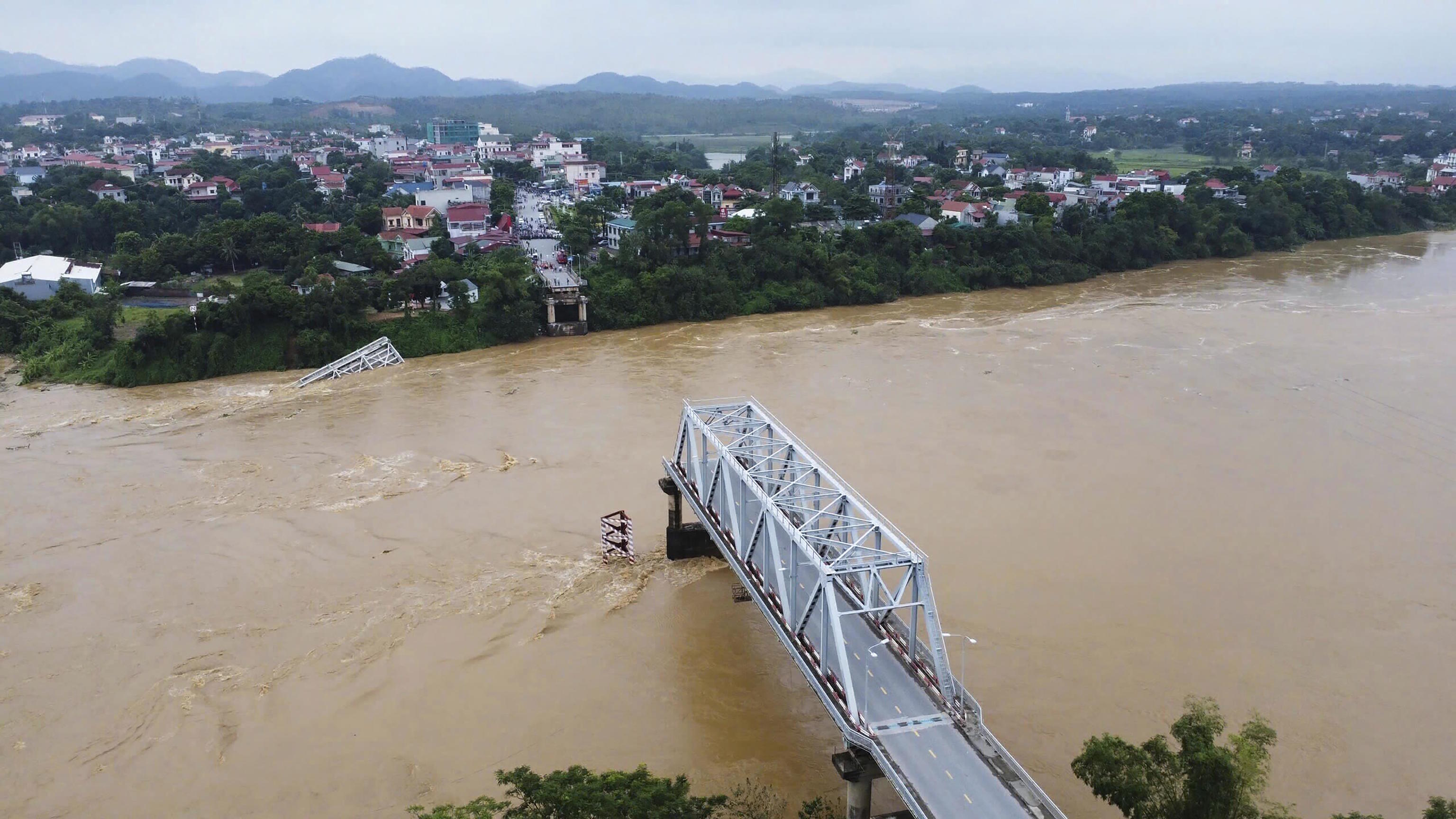 A bridge collapse due to floods triggered by typhoon Yagi in Vietnam.